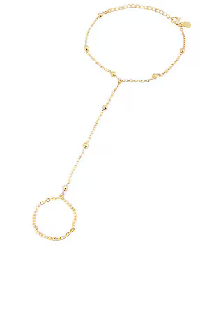 petit moments Sol Hand Chain Bracelet in Gold from Revolve.com | Revolve Clothing (Global)