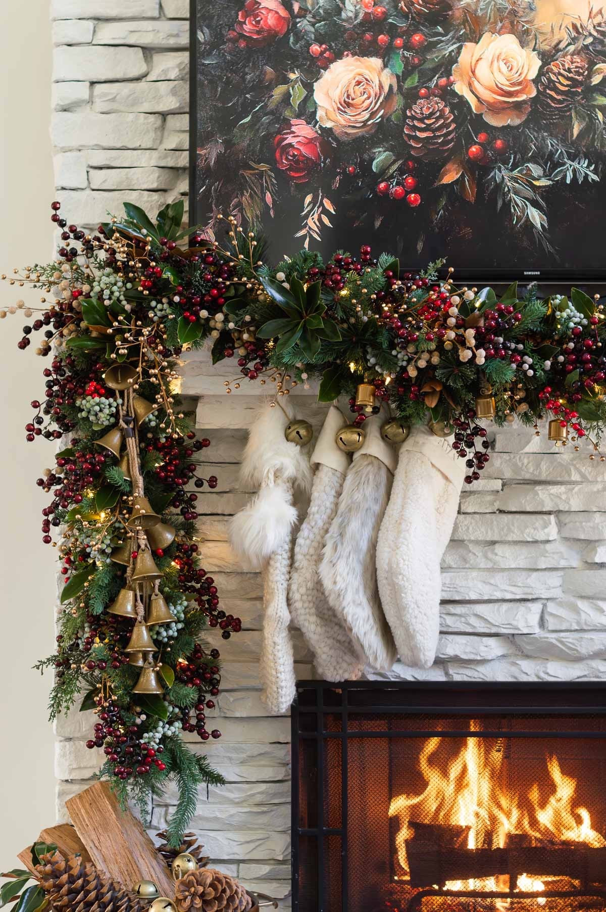 I switched up the configuration of my Christmas mantel garland this year and hung it off center. I layered in tons of gold berries, green berries and blue berries and added bell strands to complete the look. Christmas decor home decor Christmas stockings jingle bell stocking hangers 

#LTKHoliday #LTKFindsUnder50 #LTKHome