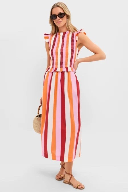 Colorful striped midi dress perfect for spring and summer. Loving this Hyacinth House smocked dress with ruffle sleeves—easy for vacation, brunch, or everyday wear. Styled with flat sandals for a casual look but can be dressed up with heels.

#LTKTravel #LTKootd #LTKMothersDay