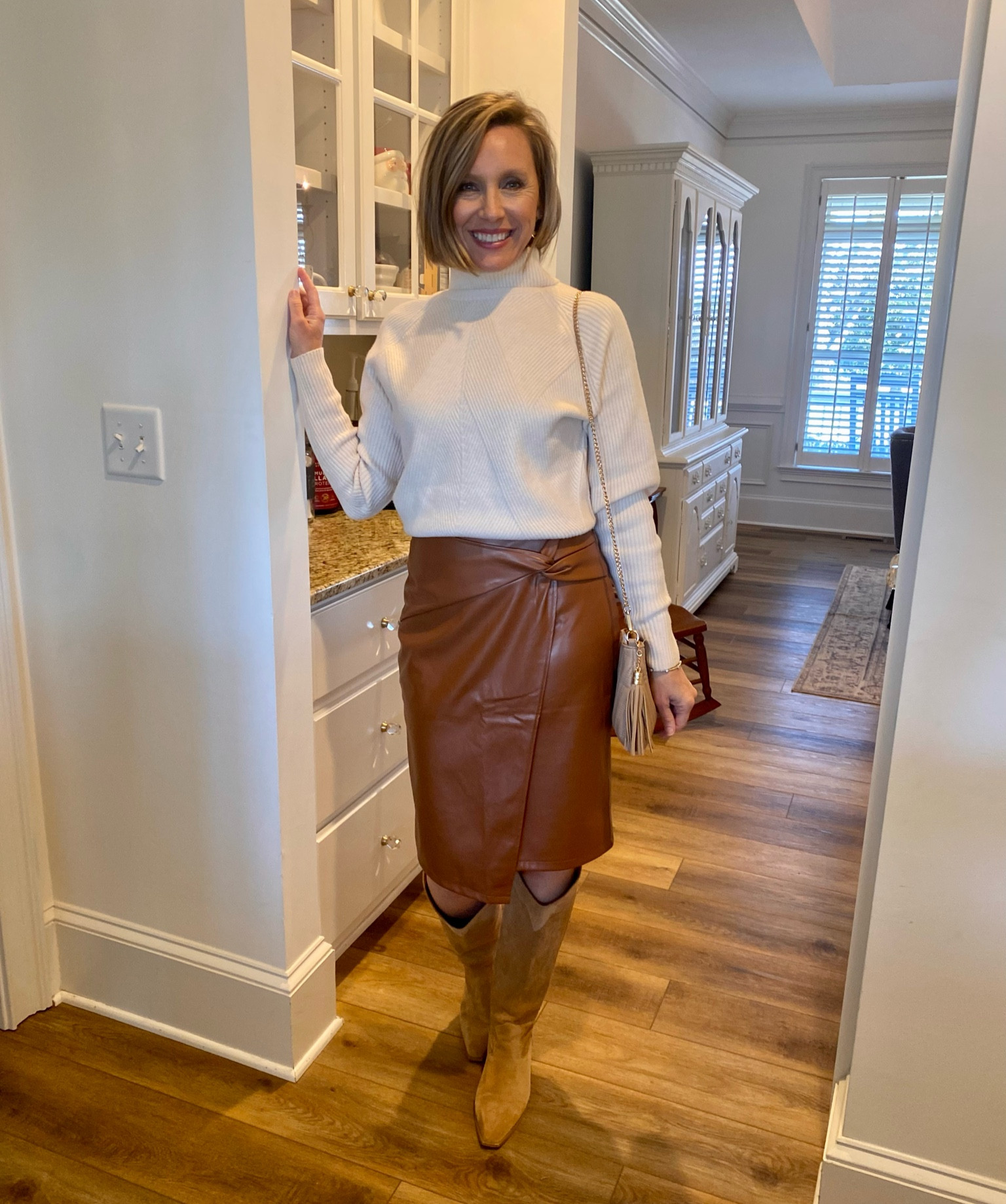 This sweater has been so versatile and a part of a set I shared earlier. Loving the skirt. The fit was perfect and I love the length. I’m wearing my regular sizes, S/4. The skirt is on sale right now!

#LTKstyletip #LTKworkwear #LTKbeauty