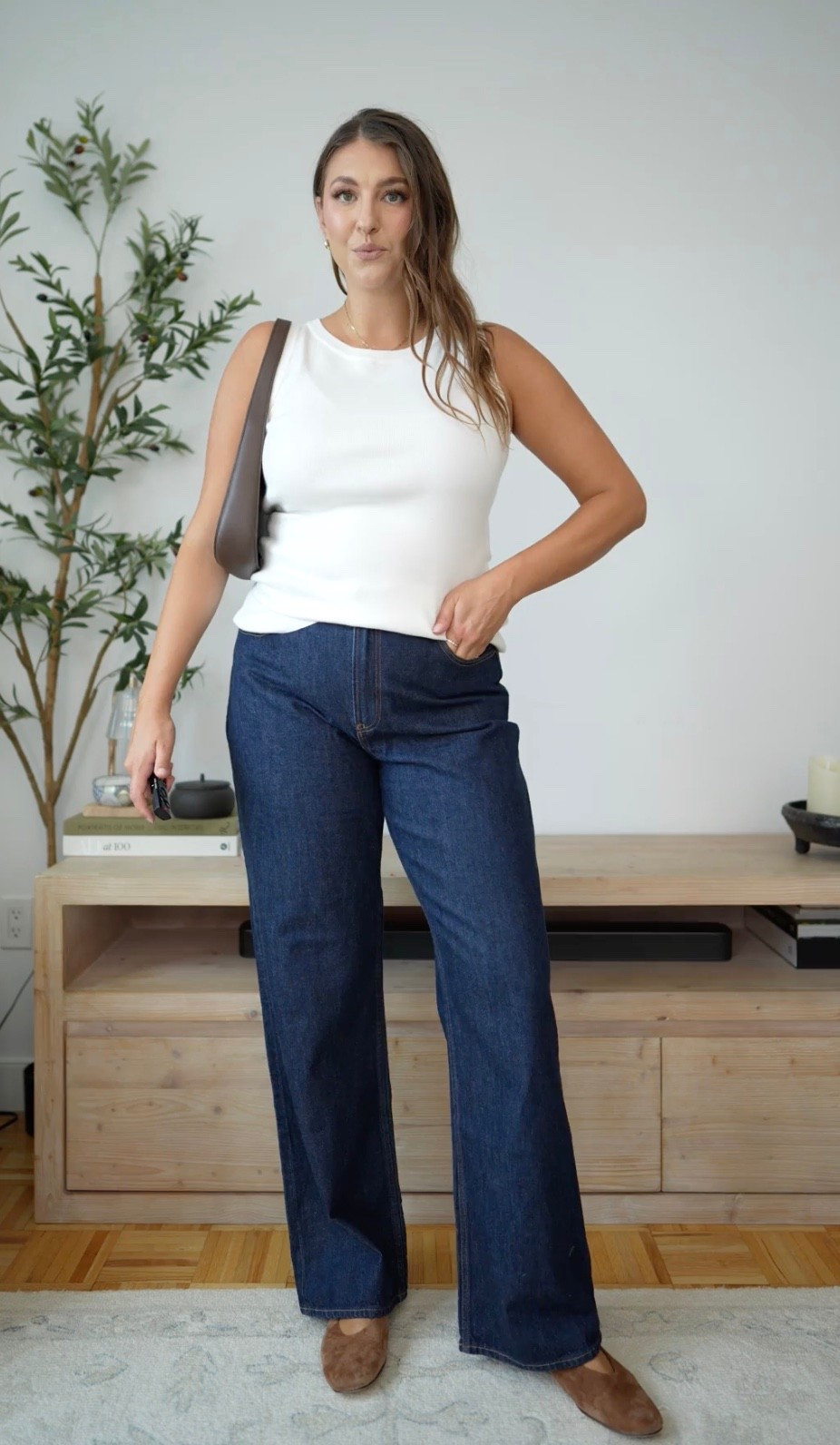 The kind of outfit that makes getting dressed ridiculously easy. Dark-wash wide-leg denim with a simple white tank feels classic, polished, and expensive without trying too hard. The brown bag and flats warm everything up perfectly.

dark wash jeans wide leg denim white tank outfit fall transition outfit classic style casual chic brown accessories everyday outfit denim outfit amazon fashion timeless style

#LTKWorkwear #LTKMidsize #LTKootd