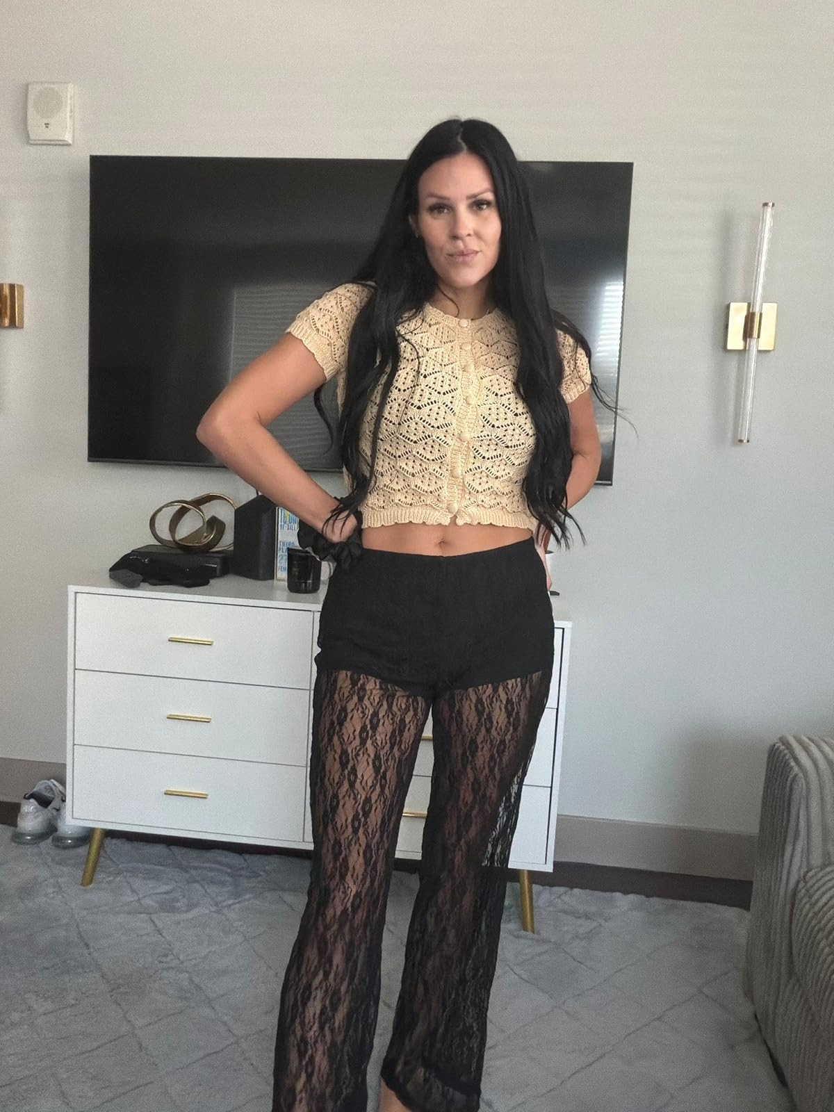 Lace and texture. This cream crochet button-up crop top paired with sheer black lace flared trousers is the perfect edgy yet feminine look for a night out. #LacePants #CrochetStyle #LTKstyletip 

 #LTKSpringSale #LTKgrwm #LTKootd