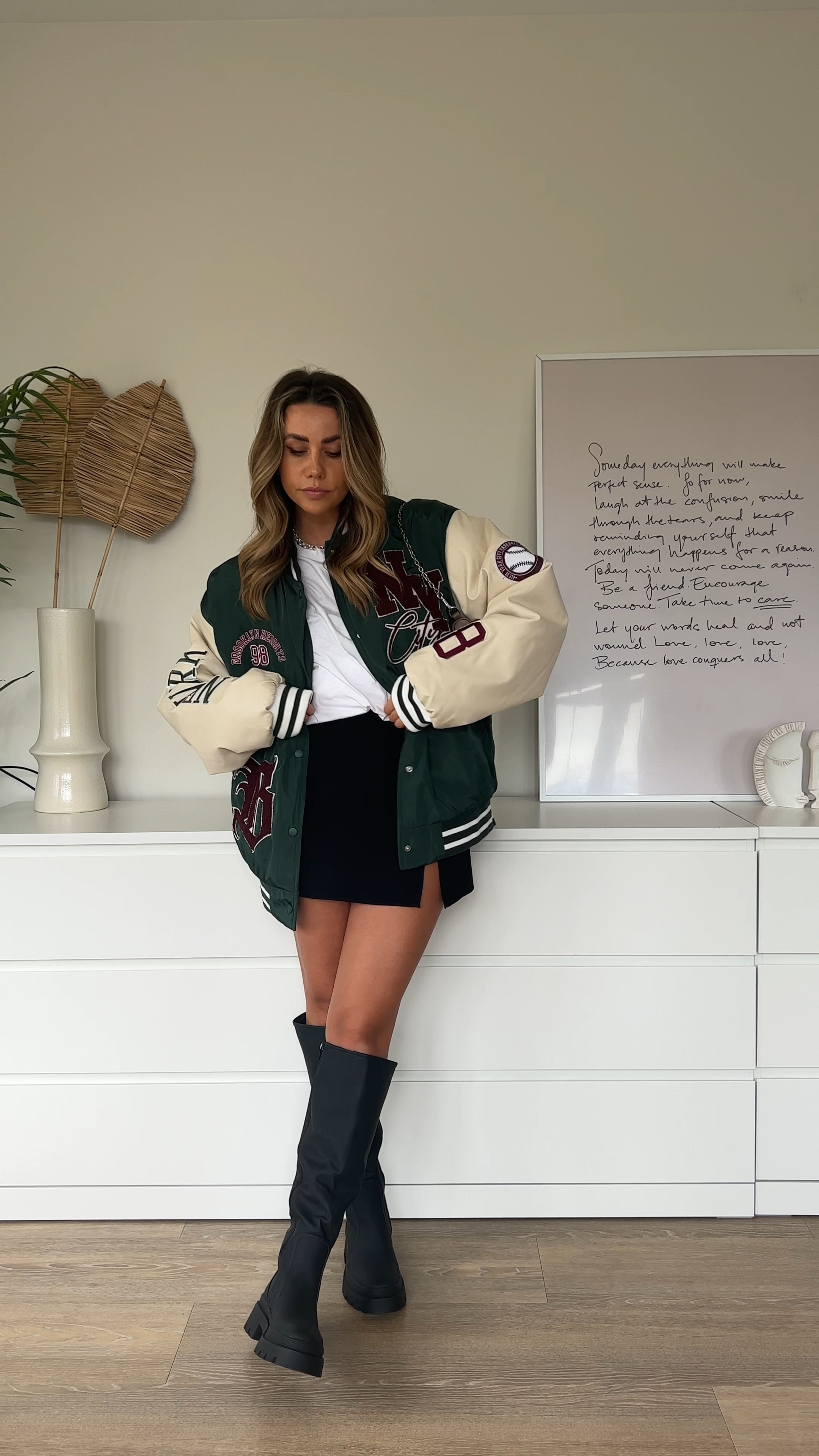 Everyday outfit idea for spring transition wearing varsity jacket with knee high boots 

#LTKstyletip #LTKeurope #LTKunder50