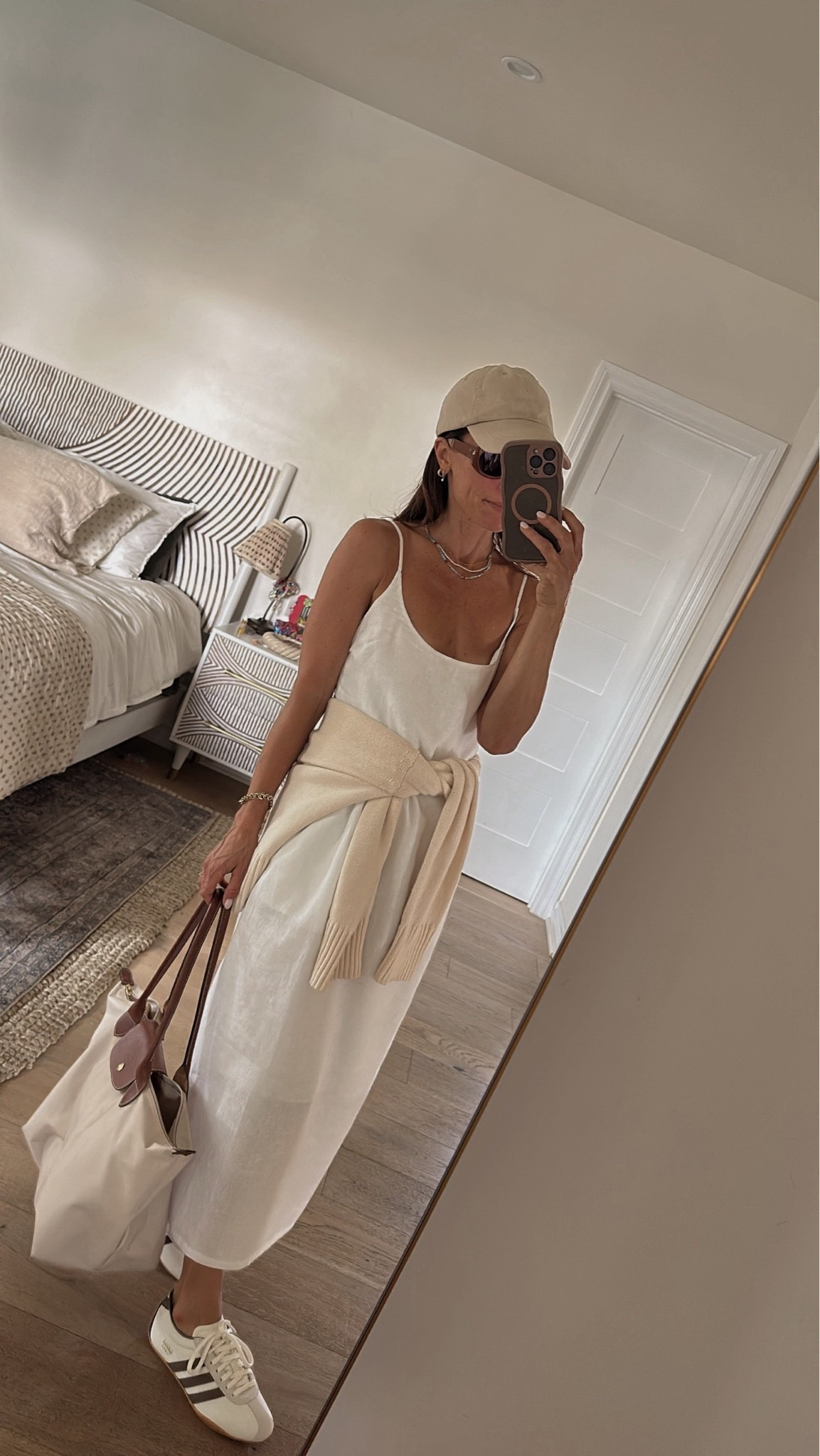 This @Quince  little white dress is coming with me to Europe this summer season and I can’t wait to style it with sneakers and a cap for exploring. It’s versatile, lined, and short gal friendly… a seamless addition to a summer wardrobe. #quincepartner

#LTKOver40