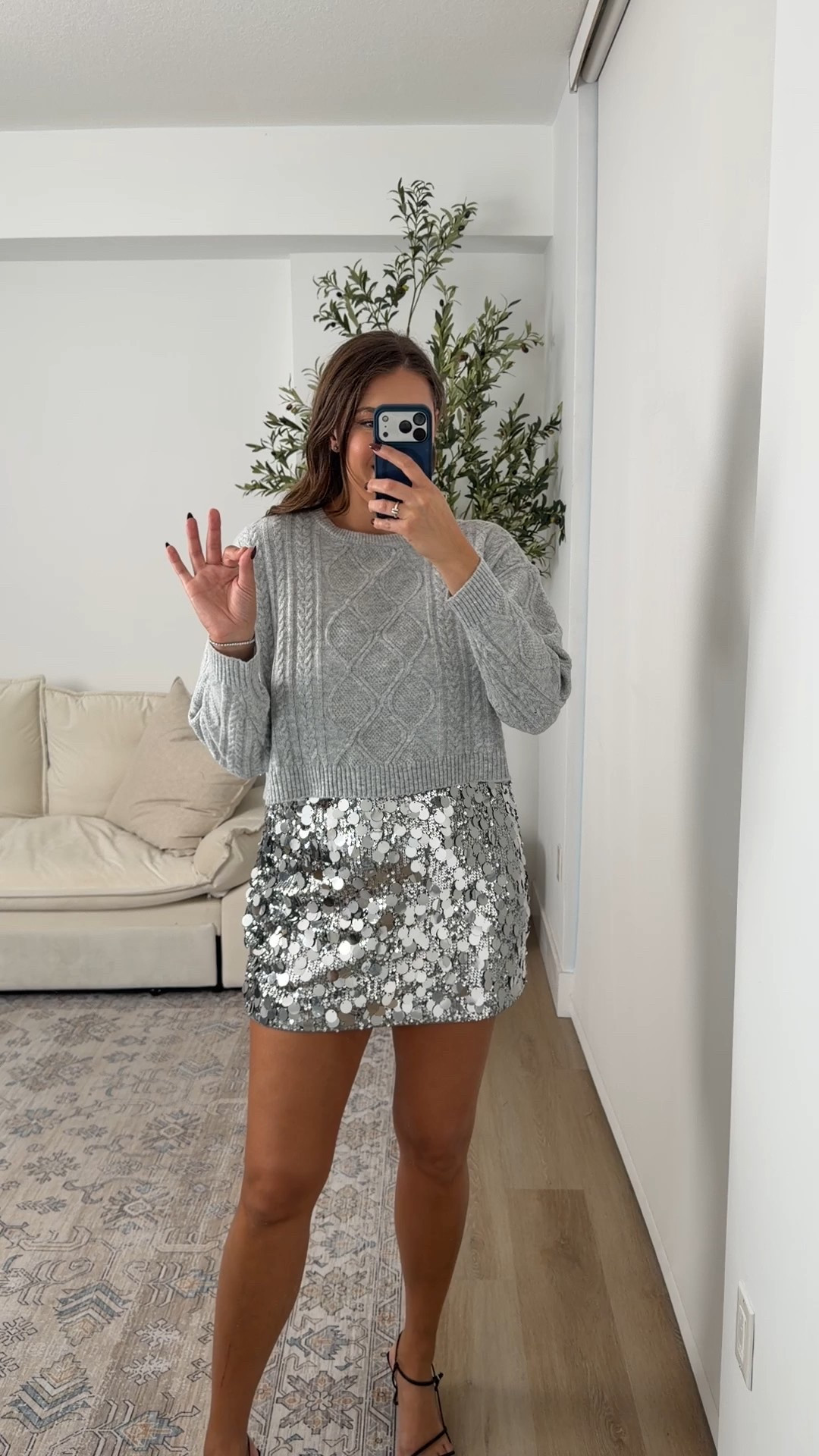 More casual NYE outfit idea with Walmart sweater and silver sequin skirt with built in shorts

#LTKMidsize #LTKTall #LTKFindsUnder100