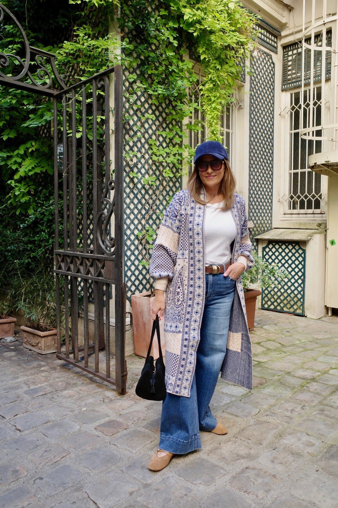 This patterned duster is such a fun statement layer for fall. I styled it with a classic white tee, wide leg jeans, and suede flats for an easy casual outfit. The baseball cap adds a relaxed touch that keeps the whole look laid back but polished. 

 #LTKSeasonal #LTKMidsize #LTKTravel