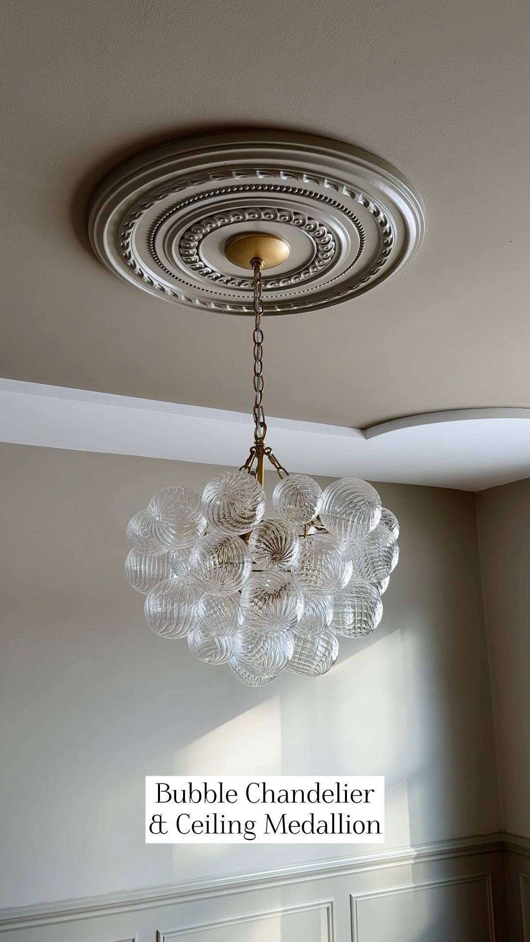 Affordable and chic bubble chandelier! This is in gold / brass and the 20” size. We paired it with a ceiling medallion that we painted to match the walls / tray ceiling  

#LTKHome