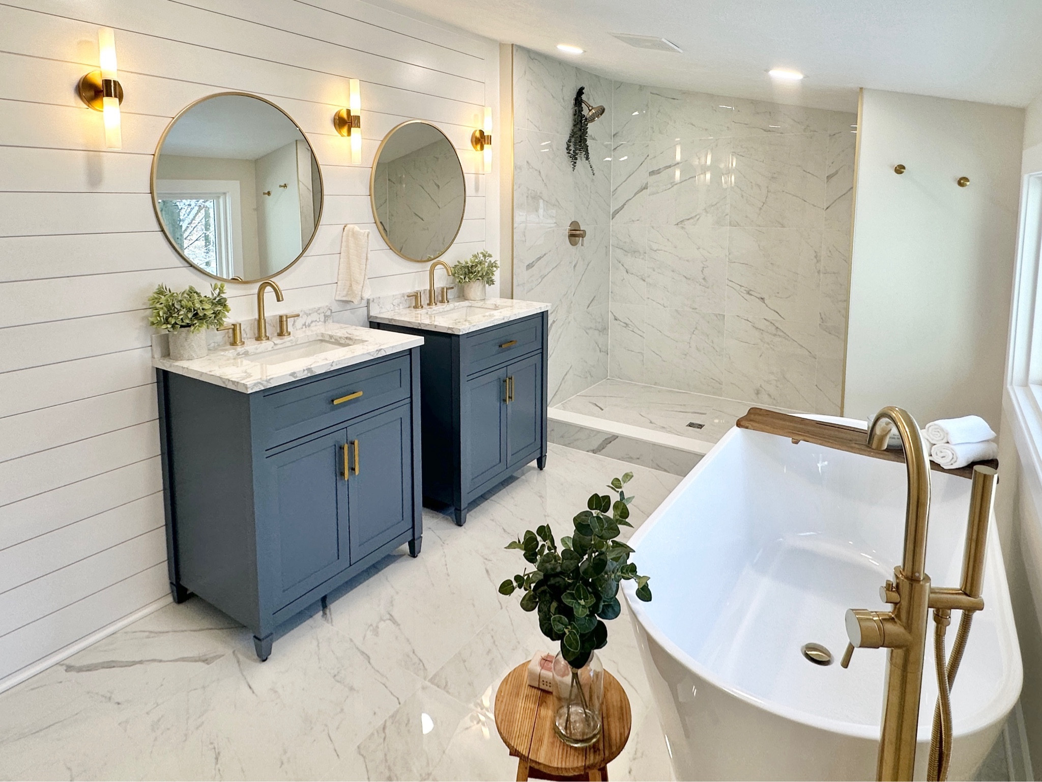 Bathroom renovation// remodel // blue vanity // tile shower // freestanding tub // master suite bathroom // tile floor // large format tile#LTKMostLoved

#LTKfindsunder100 #LTKhome