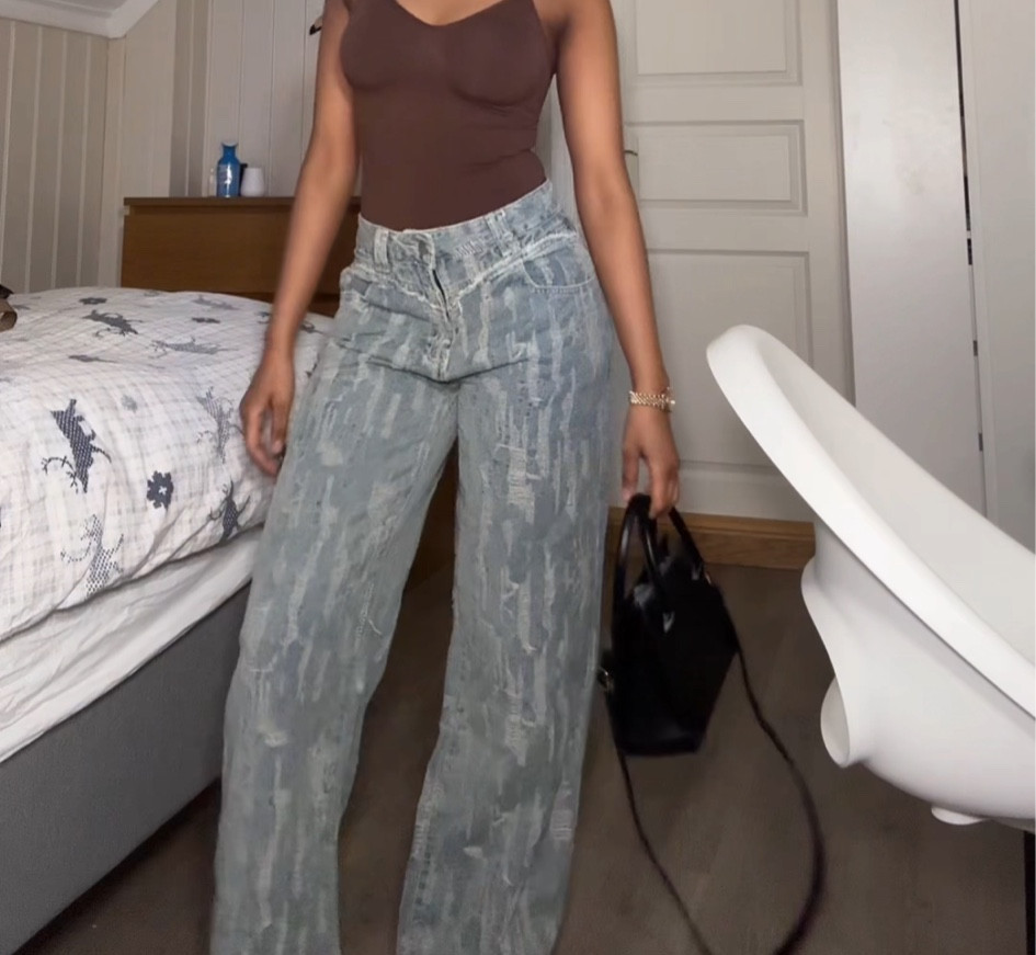 Distressed denim jeans 
