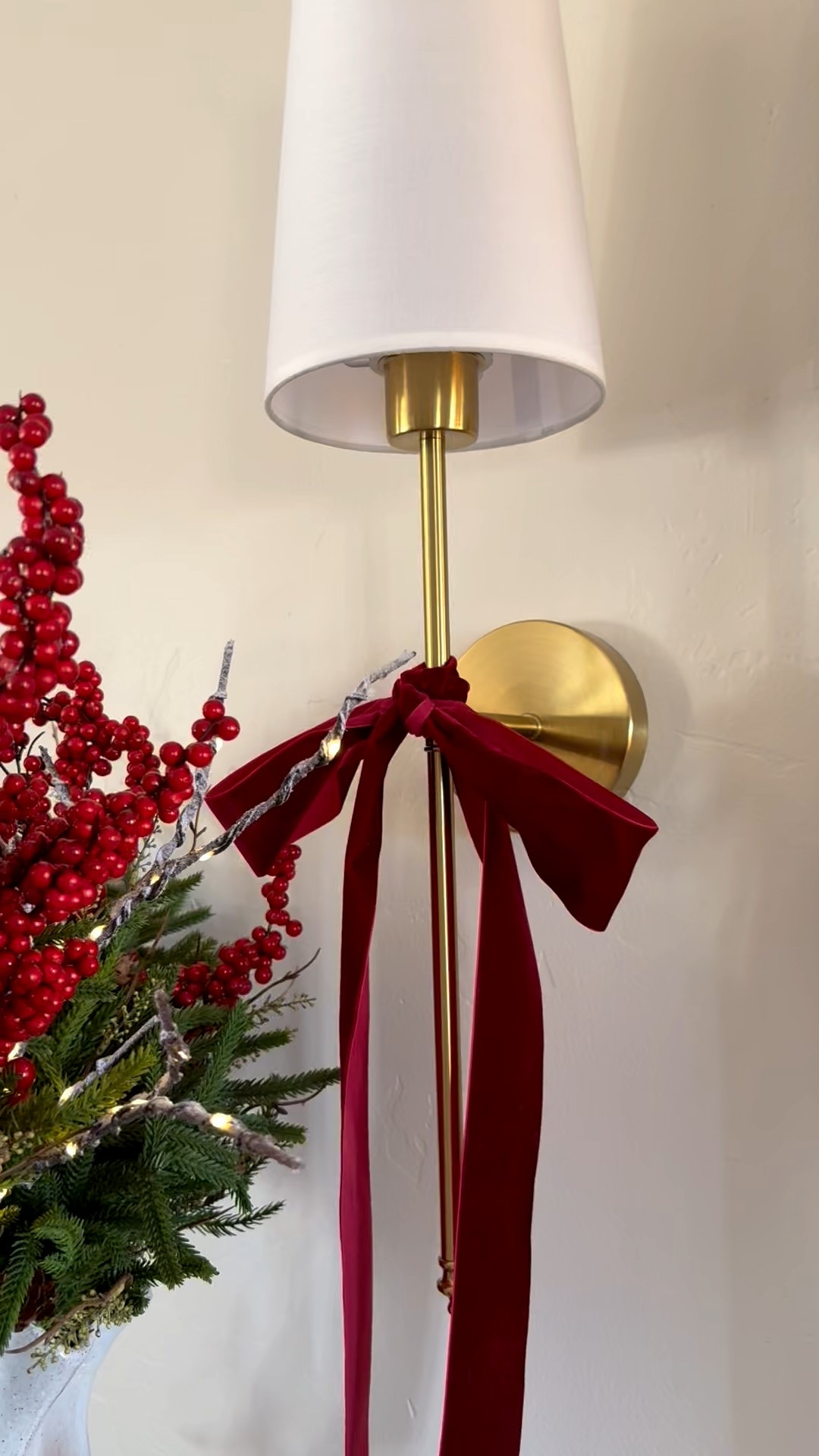 It's often the simplest little touches that make Christmas magical! Adding bows to the sconces and lighted branches to this vase of berries and greenery are the touches that make it special! 

#LTKHoliday #LTKHome
