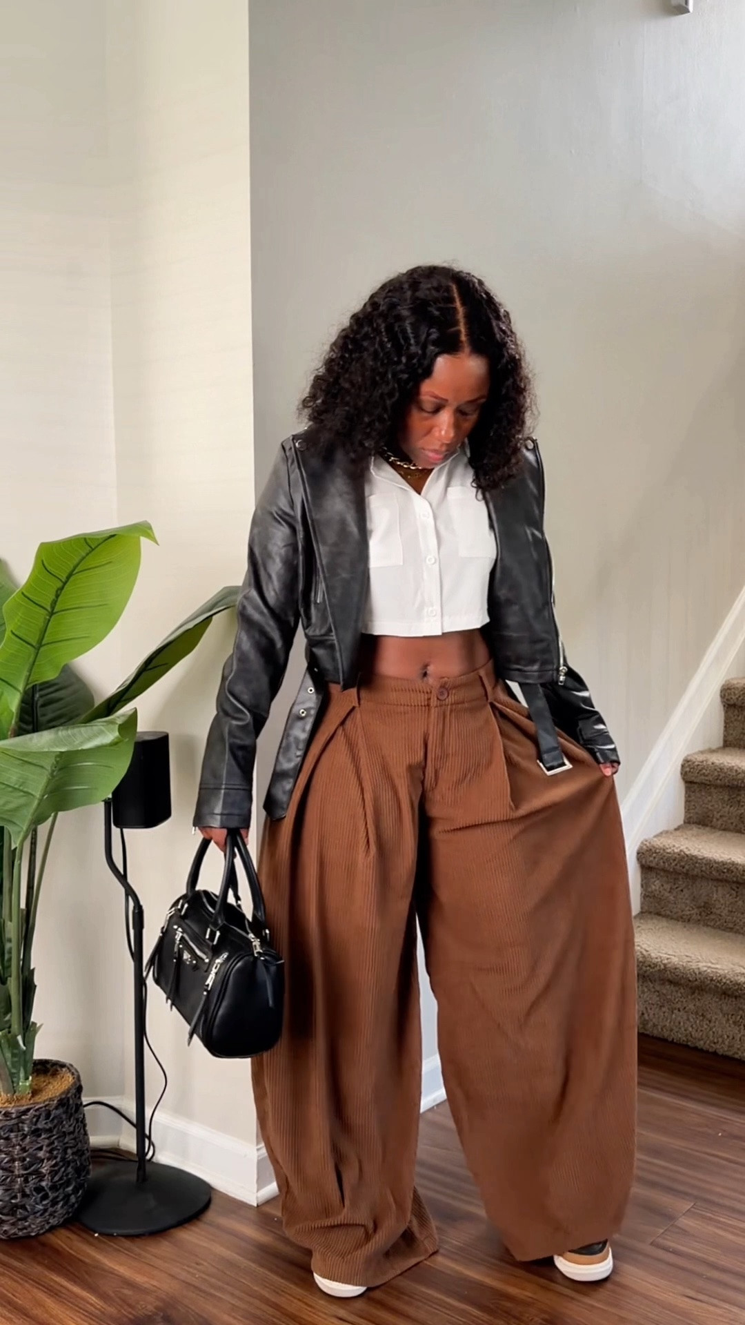 Wondering how to style a cropped leather jacket? I paired mine with oversized brown pants, a white cropped shirt, sneakers and a black handbag for a casual everyday outfit..

#LTKOver40 #LTKPetite #LTKootd