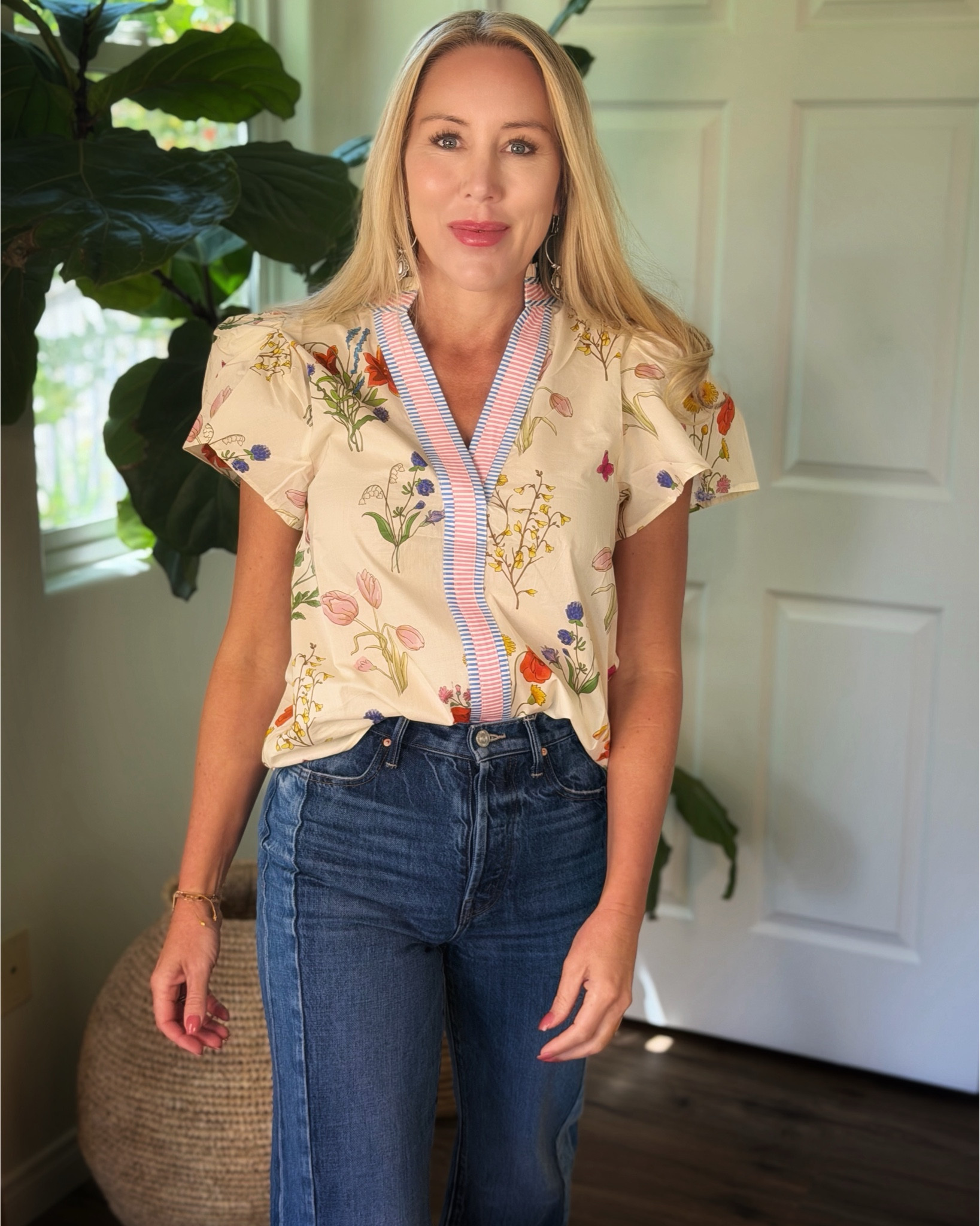 Another great floral top option! So feminine with the flutter sleeves, and I love the contrast between the floral and the stripe detail in the front

#LTKFestival #LTKOver40 #LTKootd