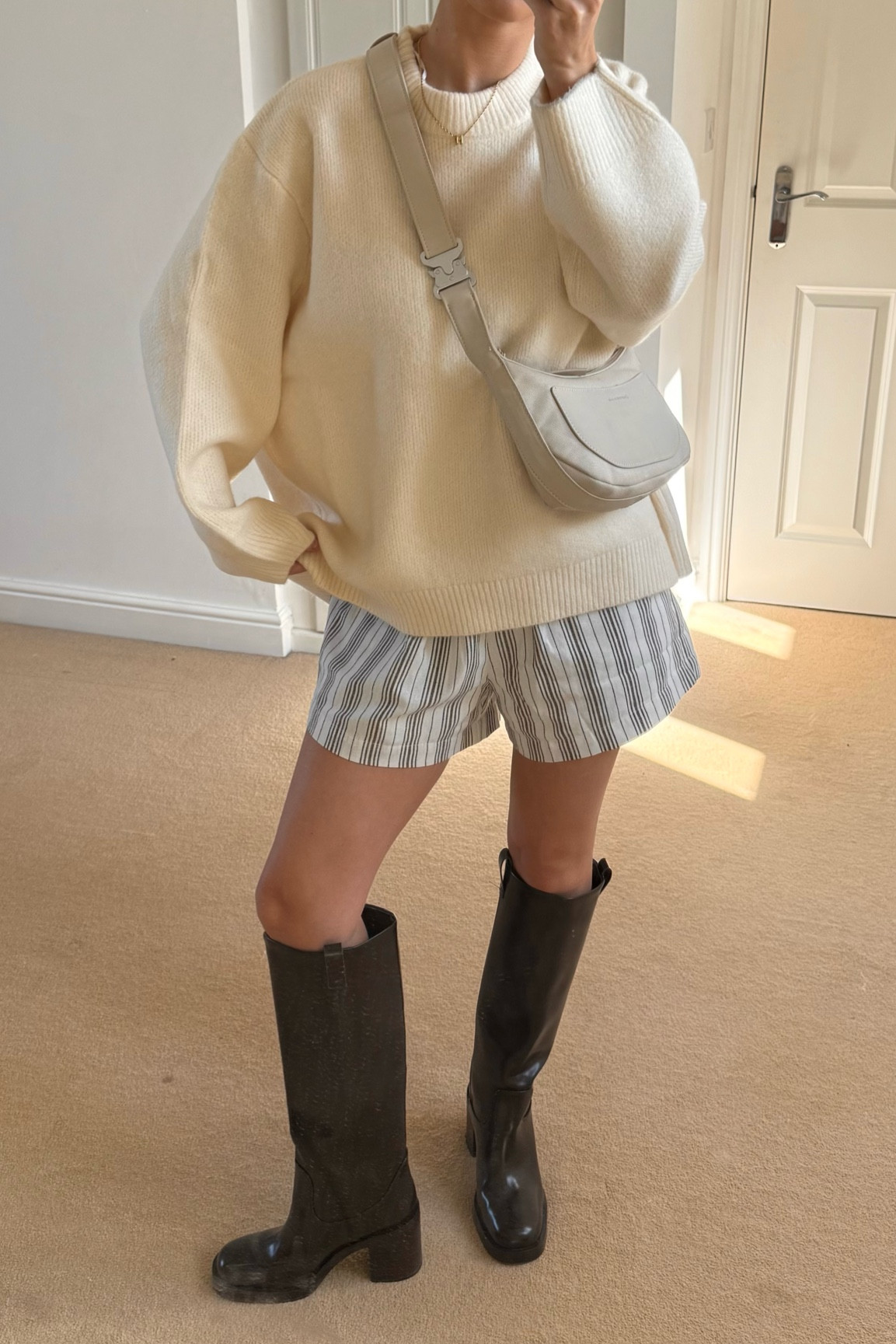 outfit inspo for that awkward bit between summer & autumn 🍂 long brown boots , chunky knit & stripey shorts 

#LTKautumn #LTKuk #LTKeurope