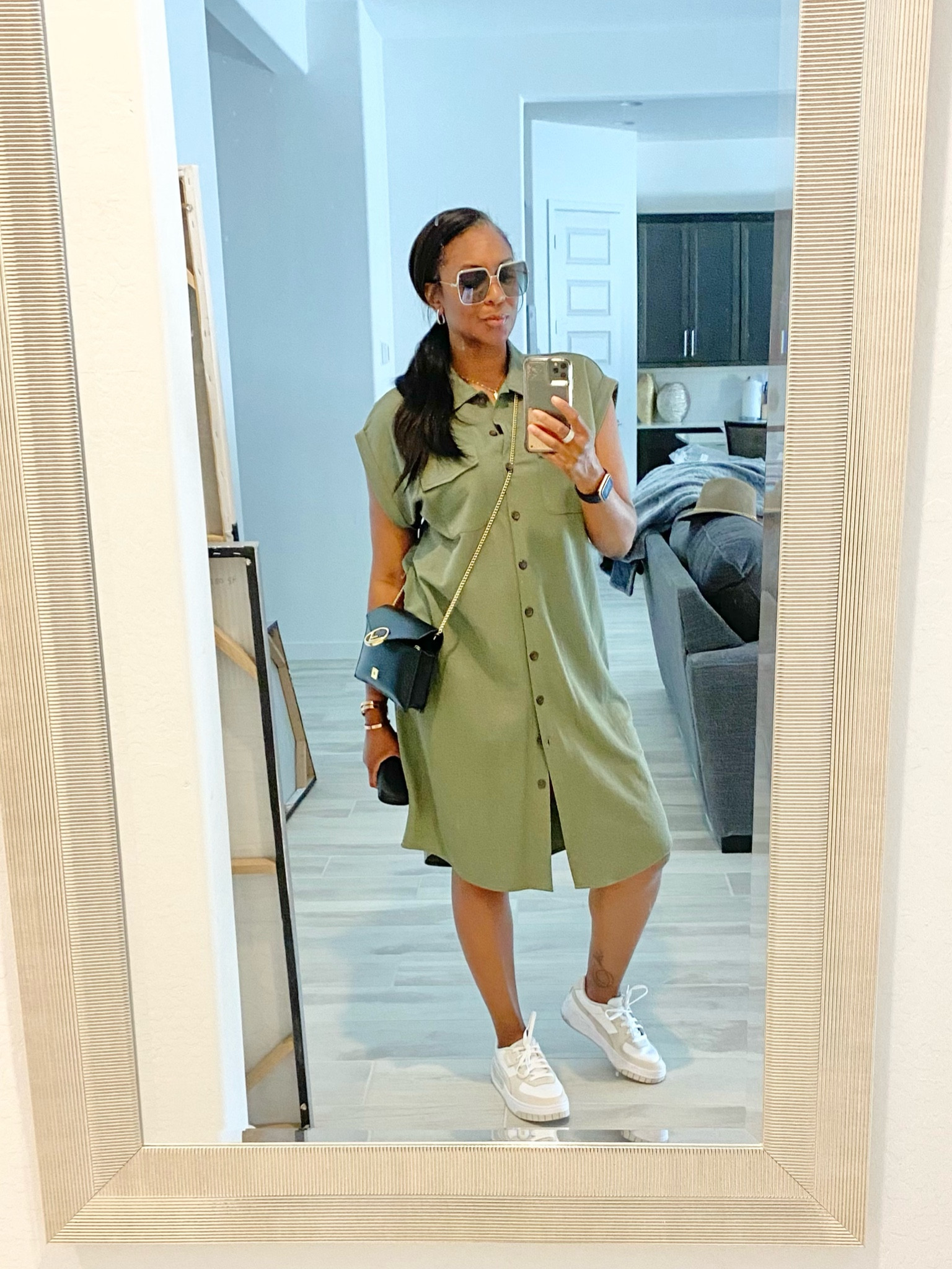 Shirt Dresses are a functional and versatile piece for your wardrobe! Adding tennis shoes keeps it cute and casual for a cute travel, everyday or weekend outfit. Adding accessories can definitely elevate your look! #WalletOnChain #MetalFrameSunglasses #WhiteTennisShoes #Bangles #LowPonytails

#LTKstyletip #LTKtravel #LTKworkwear