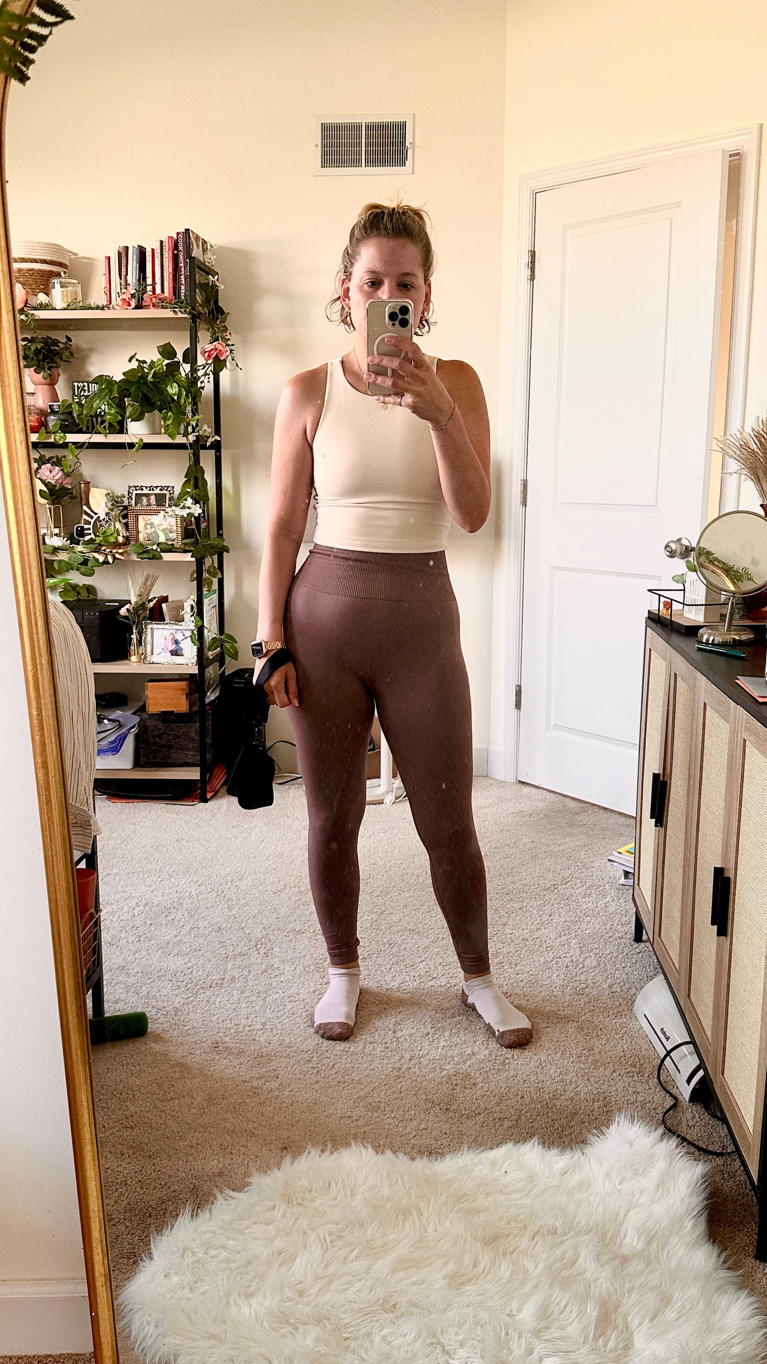 Gym OOTD the pants came with a sports bra as a set. Super high waisted. Size down in both for more compression. This is the brown coffee color but looks more purple in person. The tank is double lined and super soft but still has some moderate support. All from Amazon including the cabinet and bookshelf.

#LTKSeasonal #LTKSaleAlert #LTKActive