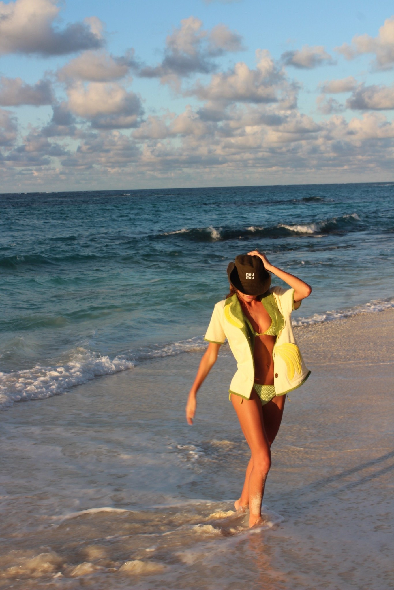 Do nothing club 🌴 wearing Miu Miu cowboy hat, green solid and striped bikini, and Tombolo terry cabana shirt 

#LTKStyleTip #LTKSwim #LTKTravel