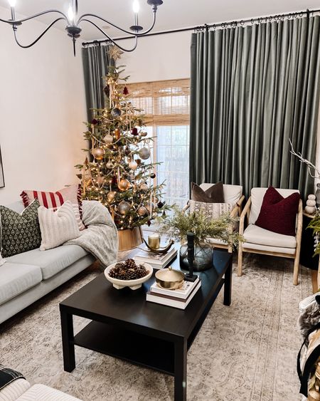 Living room, coffee table, velvet curtain, Christmas tree, holiday pillow, accent chair, throw blanket, vase, greenery, bowl, rug 

#LTKSeasonal #LTKhome #LTKGiftGuide