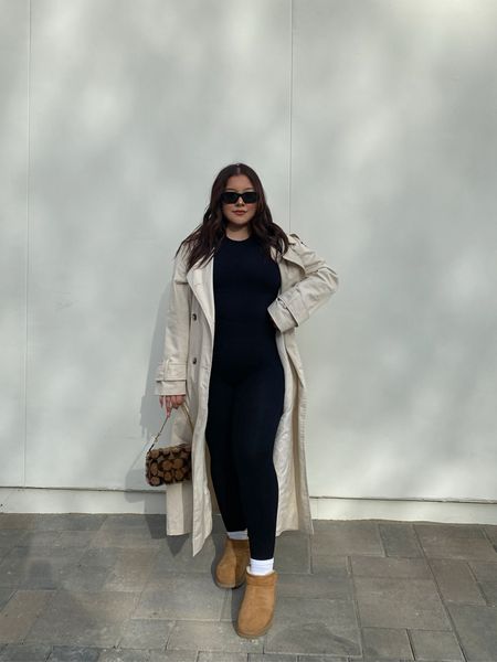 Ultra mini uggs outfit, transitional style, trench coat outfit, black jumpsuit, black unitard, winter outfit, spring outfit, minimal style, simple outfit, everyday style

#LTKfit #LTKunder100 #LTKstyletip