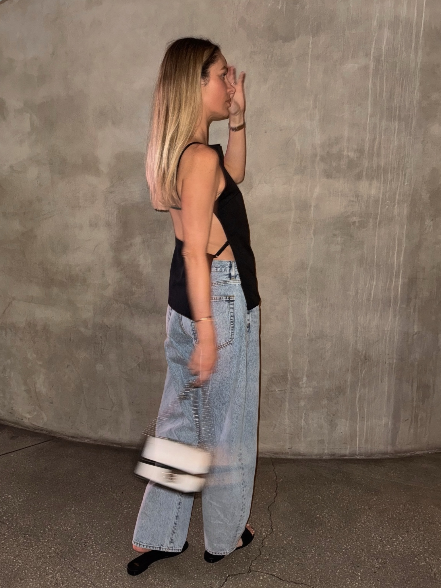 Backless top with barrel bubble jeans and chic slides. Effortless minimalist chic look. 
