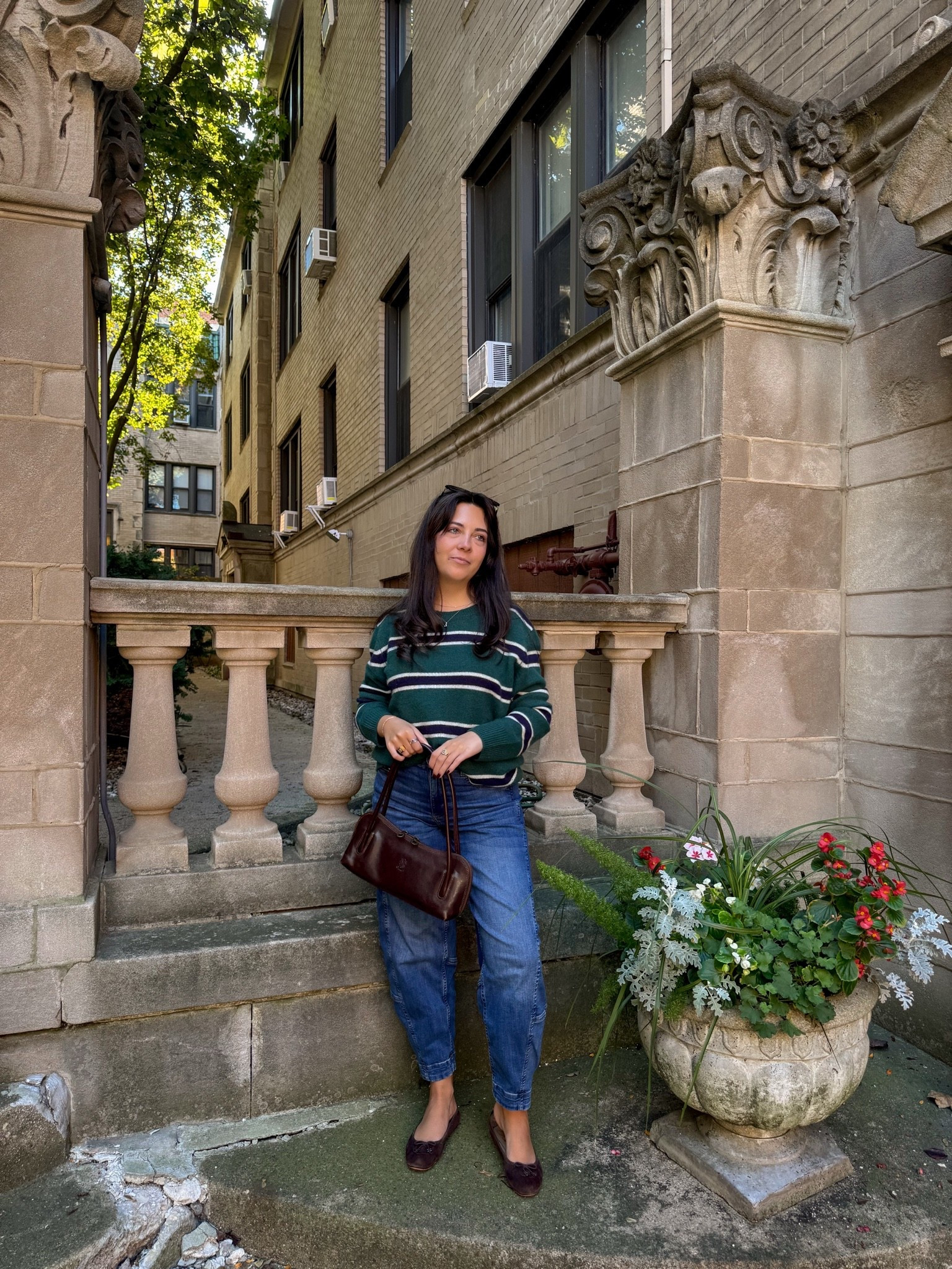 A little prep school, a little off-duty 🤎🍂 Leaning into classic fall style with a striped knit sweater, barrel leg jeans, chocolate brown ballet flats, and a vintage-inspired shoulder bag. The perfect casual fall outfit for coffee runs, weekend strolls, and everything in between. Love how the rich brown accessories pull this everyday look together!