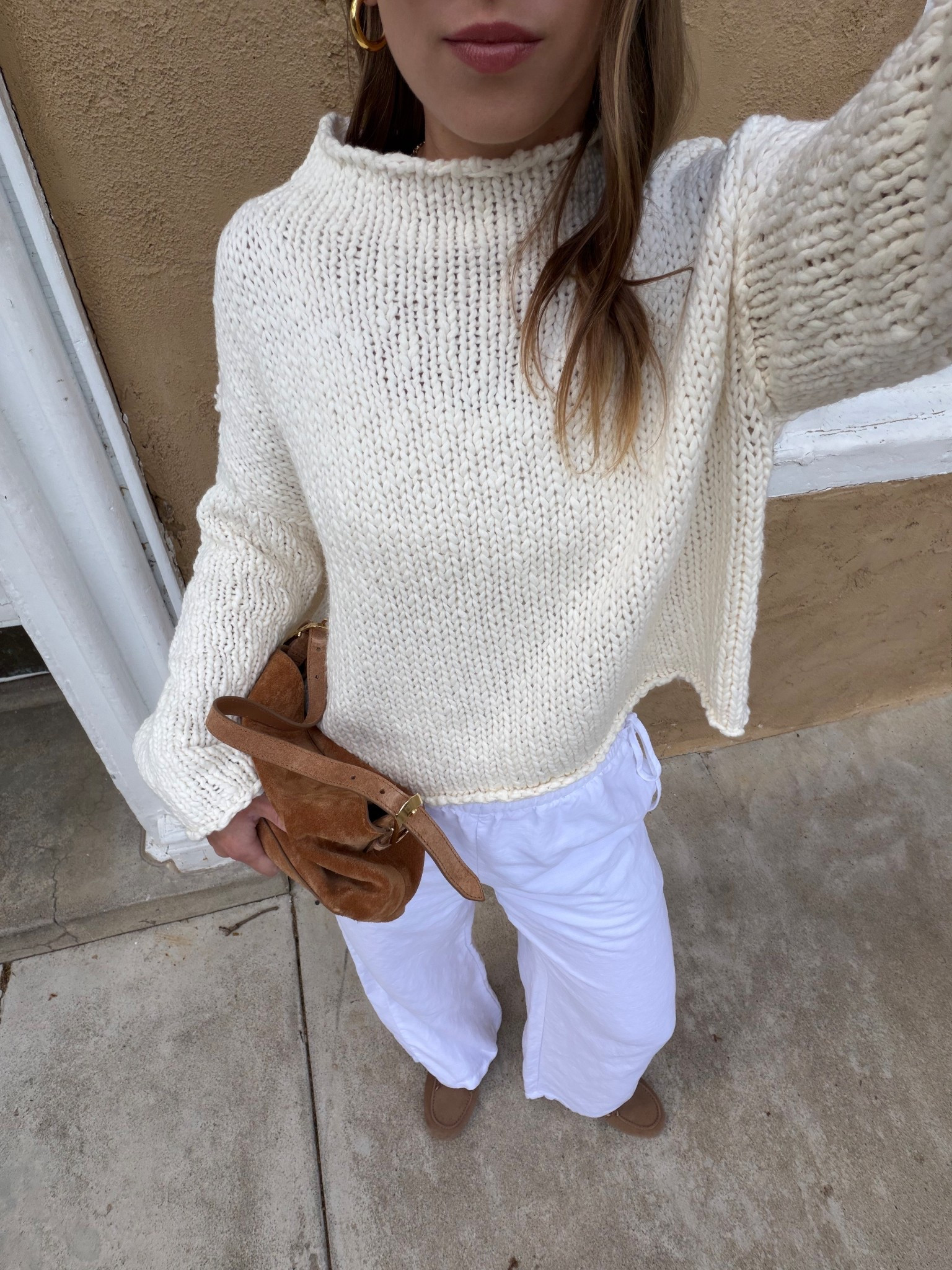 4/22/26 Chilly Spring to Summer Outfit One of those in-between outfits for a chillier spring day 🤍 Aritzia linen pants (wearing a small) with a cozy Free People knit (wearing a medium), paired with my boat shoe slides from Anthropologie. Finished with my J.Crew suede bag and blue light glasses—everything is linked here ✨

#LTKootd #LTKSeasonal
