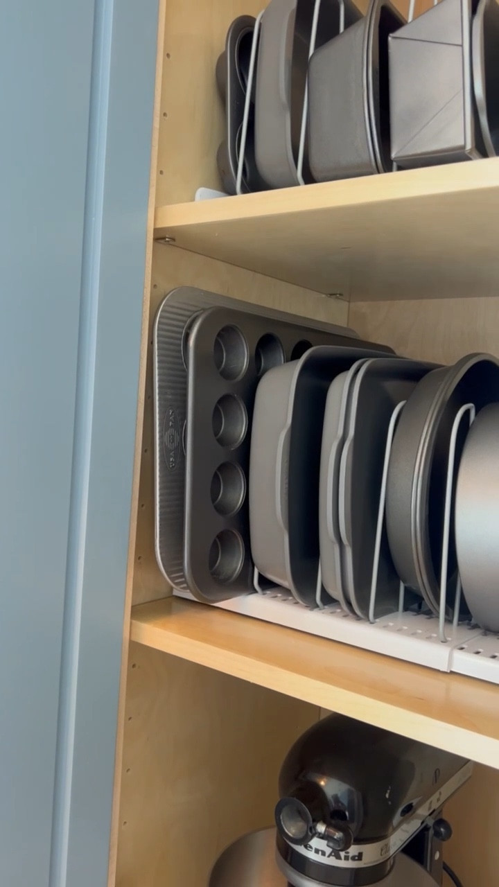 A space saver!! Tired or stacking your trays and baking pans? This organizer is one of our top organizing solutions for all of our clients kitchens!  Use it to store pans, cookie sheets, cutting boards, serving trays, and more! ✨Make it happen in your home✨ #kitchen #organizer #organizing #organization 

#LTKhome #LTKVideo