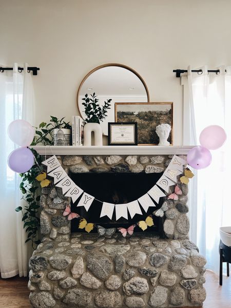 Butterfly birthday fireplace mantel decor!
-
Second birthday - girl birthday - butterfly banner - minimalist white and gold happy birthday banner - ceramic vase with two legs - round wood framed large mirror - framed vintage landscape art - target studio mcgee - affordable art - Amazon home decor - H&M home decor - pink balloons - purple balloons - artificial greenery stems - Afloral - Grecian bust vase - girl birthday decor 

#LTKhome #LTKunder50 #LTKkids