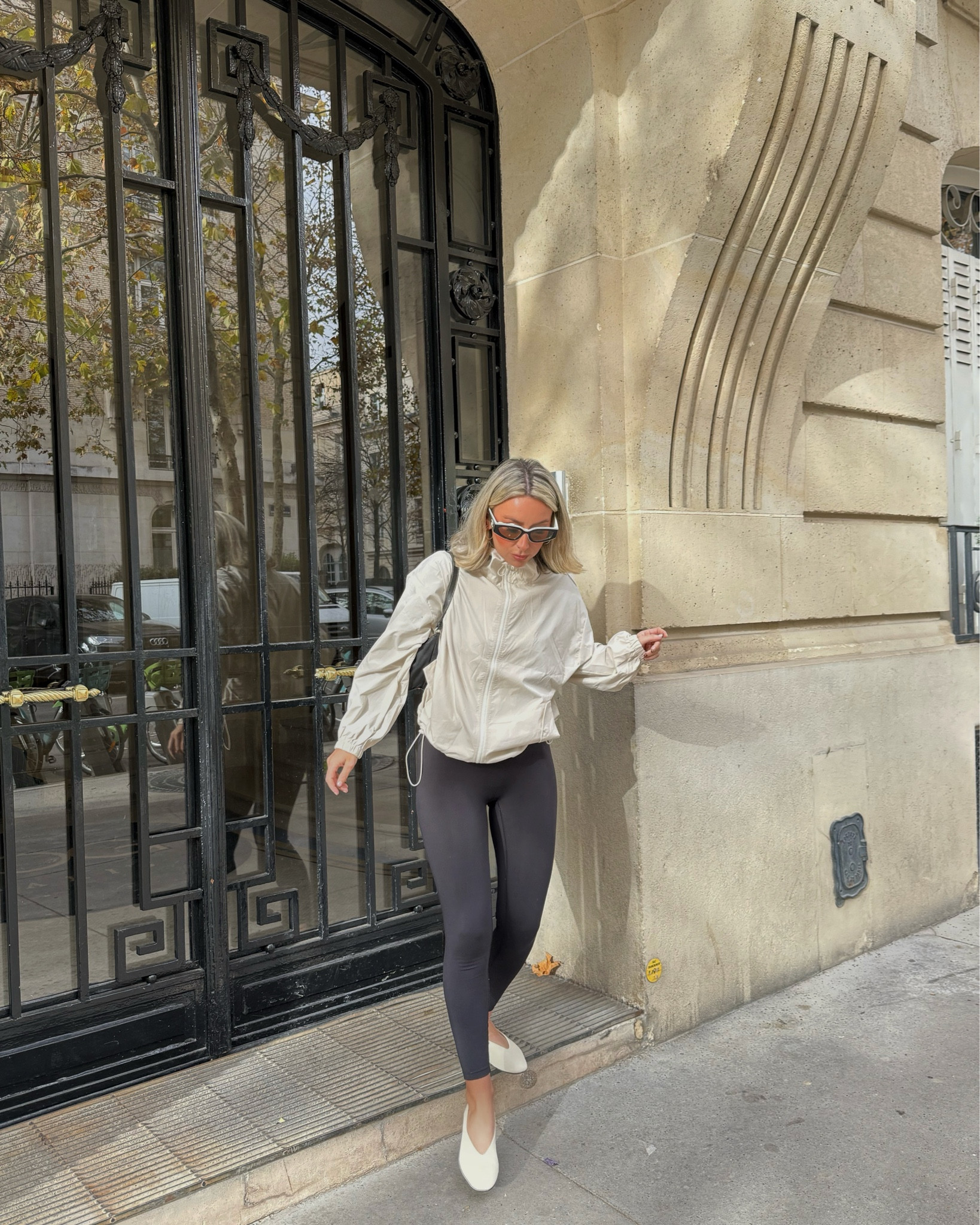 Paris outfit ootd. Rain jacket fits ☁️

Comfy but chic Paris street style with a cropped white rain jacket and black leggings with statement chanel sunglasses and white ballet pumps. 

#LTKCyberWeek #LTKstyletip #LTKautumn