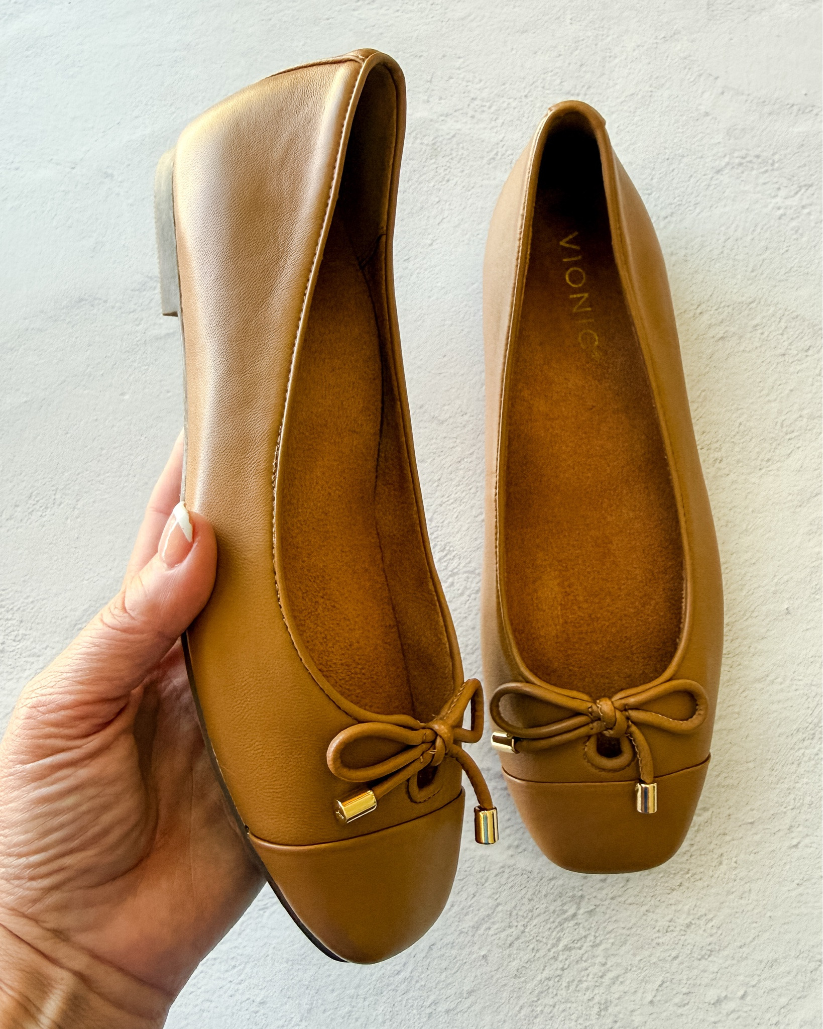 These cognac leather bow flats give you the support your feet will thank you for — proof pretty and practical can be the same shoe.

#LTKWorkwear #LTKSeasonal #LTKmomlife