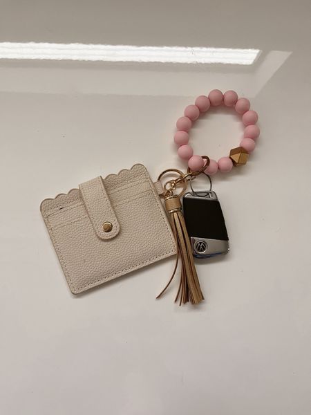 This is so great if you are running errands and do not want to take a purse! It has been a lifesaver for me while having a newborn!

Keyring, cardholder, bracelet, phone holder. 