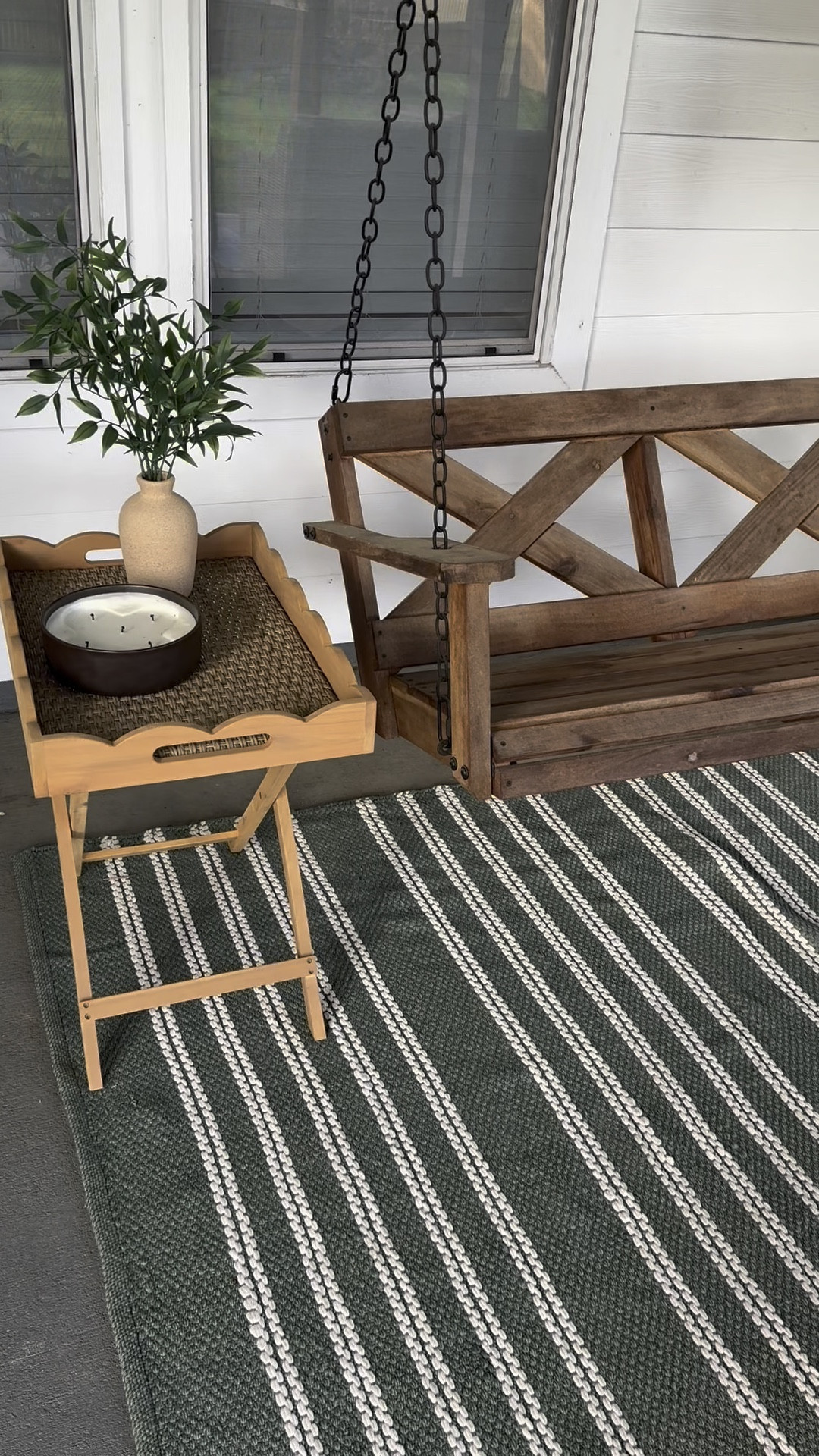 Back porch swing is summer ready! Added an outdoor rug & outdoor table, plus a citronella candle to keep the mosquitos away! 

#LTKVideo #LTKhome #LTKSeasonal