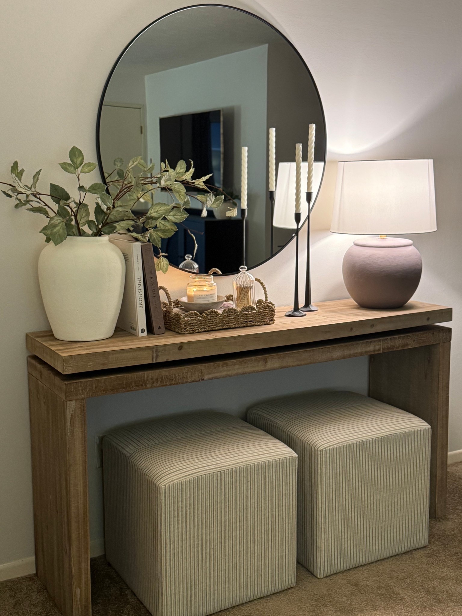 Wood console table, entryway decor, entryway styling, stripe ottoman, ottoman, round mirror, hd mirror, sage stems, spring stems, coffee table books, scallop tray, black candlesticks, candle bowl, cream vase 

#LTKSaleAlert #LTKHome #LTKSeasonal