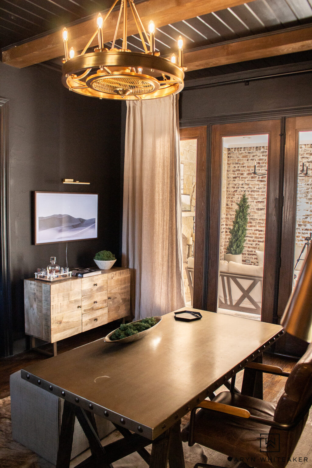 Moody home office inspiration with warm wood tones, brass lighting, and modern rustic details. This workspace features a statement chandelier, industrial desk, leather seating, and layered textures that create a cozy yet elevated office design. Perfect ideas for a home office makeover, masculine office decor, modern farmhouse office, or a stylish work-from-home space that feels both functional and inviting.

#LTKHome #LTKSeasonal #LTKmomlife