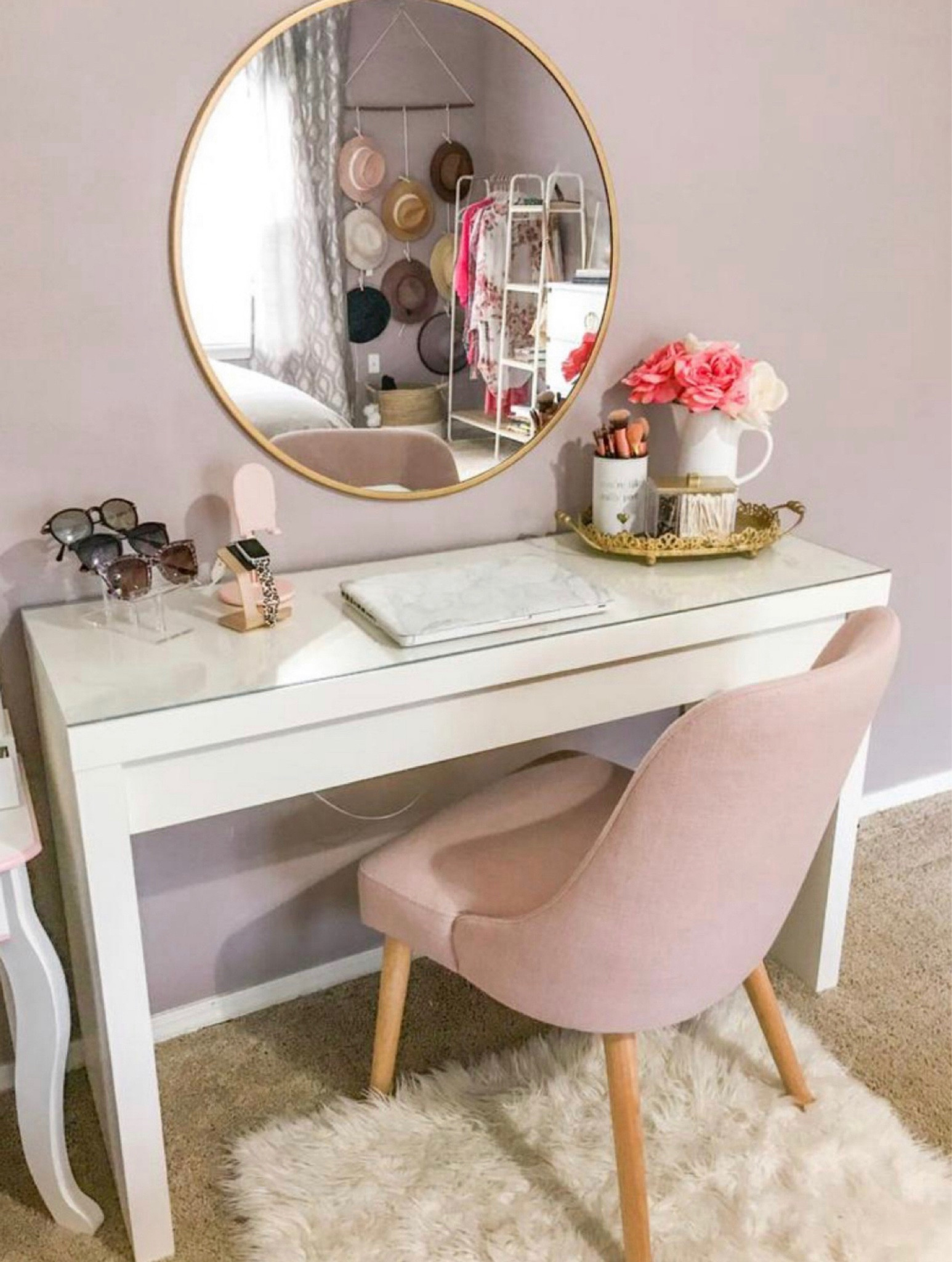 Vanity and office space combined!!! I love this white desk, pink blush chair and gold circle mirror combo. Home decor: clothing rack, sunglass holders, gold Apple Watch stand/pink iPhone stand holder, leopard Apple Watch, gold organizers and marble laptop case. Linked all of these from target and amazon! 

#LTKHome #LTKBeauty #LTKGiftGuide