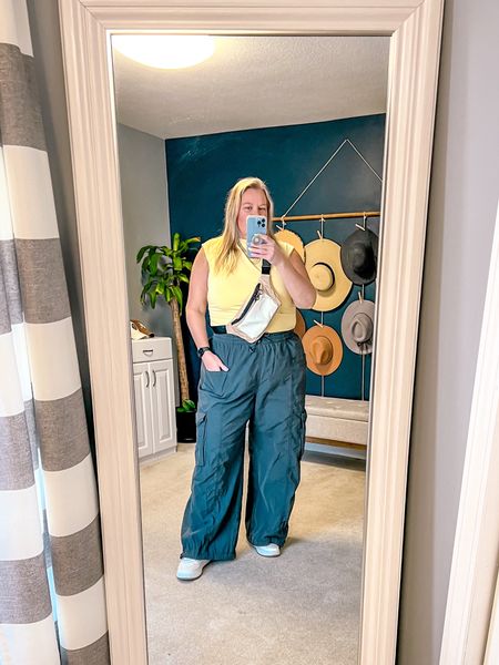 A little baggy cargo pants outfit styled for spring. I offset these baggy pants with a fitted top. This yellow ruched tank comes in several more spring colors as well as some neutral colors. I wore with my new cross body bag and favorite platform sneakers that are great for walking. 

I’m wearing a XXL in the pants and top. Both fit TTS. 

Plus size spring outfit 
Plus size outfit idea
Spring fashion 
Spring style
Vacation outfit 
Spring outfit 
Cargo pants
Baggy pants 
Bumbag 
Crossbody bag 
Sling bag 

#LTKSpringSale #LTKsalealert #LTKitbag
