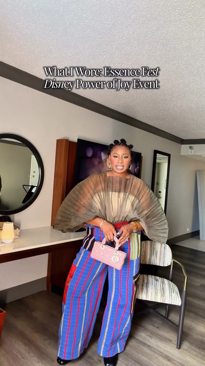 Thank you for having me @disney @essencefest 🫶🏽
Outfit check for Disney Power of Joy Event! I love an elevated casual look ESPECIALLY if the shoes are comfy. 

Lately I’ve been leaving more into prints, patterns and textures and adding them to my style. It’s so much fun and reminds me to play around with color again too. 

Top: @andreaiyamah 
Pants: custom made 
Bracelet: @asos 
Shoes: @shopakira 
Glow: @dibsbeauty 
Fragrance: @kayali @josiemaran 
Bag: @dior 
Sunglasses and bandeau: @amazon 

Comment “Link” and I will dm links to this look your way.