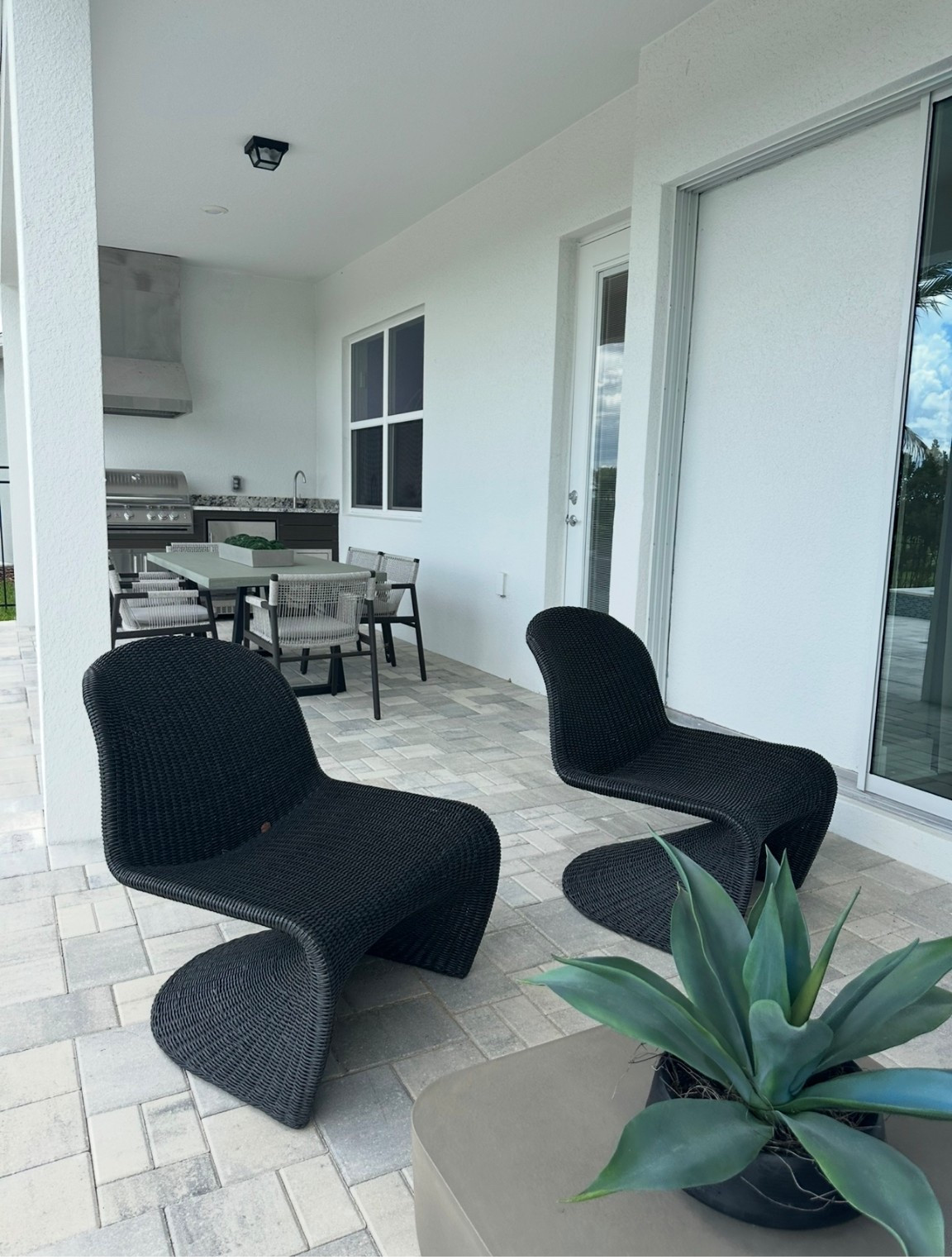 Black wicker patio chairs perfect for your lanai.

#LTKHome #LTKStyleTip
