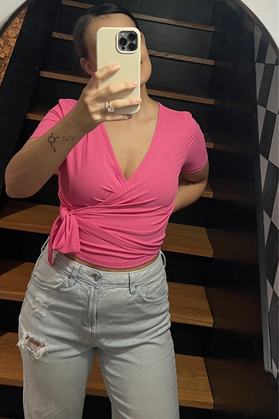 Pink wrap crop top is so flattering and affordable! Love it paired with these distressed high rise jeans. 

#LTKfindsunder50 #LTKstyletip