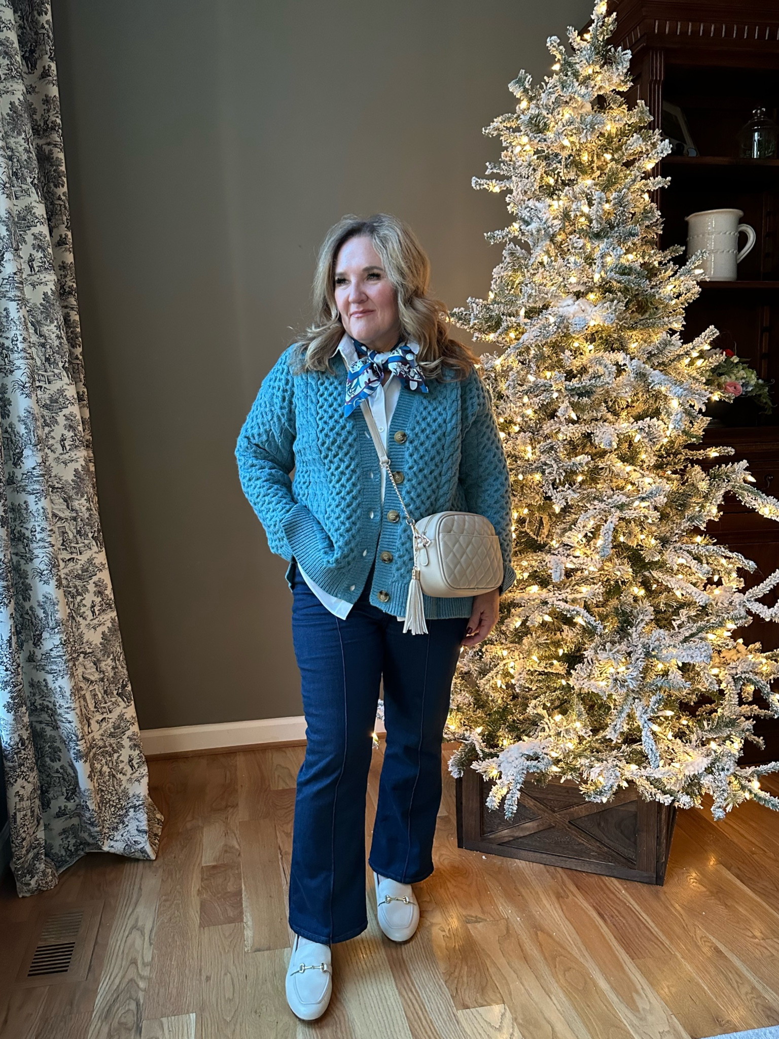 Holiday winter casual. 

This sweater is gorgeous. Think the quality of an Irish sweater. Oversized. I’m in a large. 
White blouse size 2.5. No iron. 
Jeans size 31. 

Linking similar loafers  

#LTKfindsunder100 #LTKover40 #LTKCyberWeek