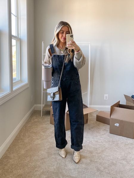 Cutout sweater and black free people overalls, wearing medium in the sweater and small in the overalls but wish I had done small in the sweater and xs in overalls! Go with tts for sweater and consider sizing down for overalls, especially if short/petite!

#LTKSeasonal #LTKstyletip