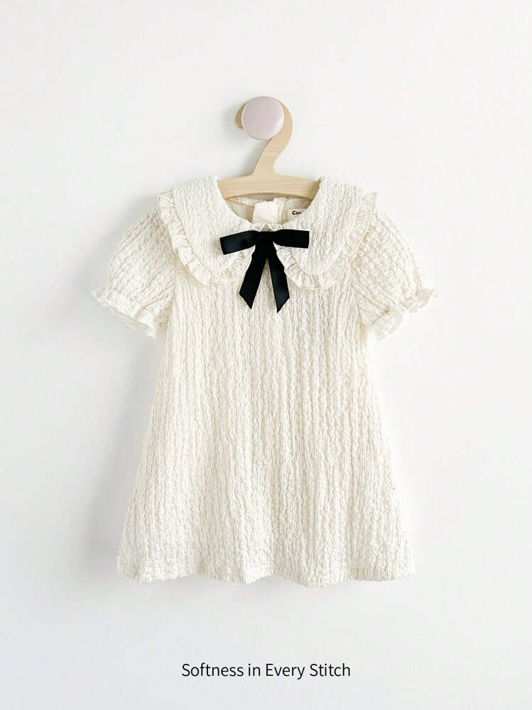 Cozy Pixies Baby Girl Short Sleeve Waist Cinched Dress With Decorative Bow And Peter Pan Collar | SHEIN