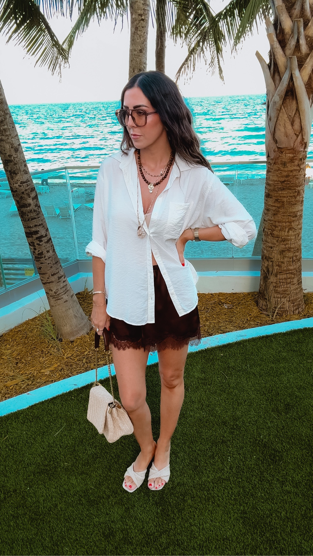 Comfy and casual vacation dinner look! Wearing a loose fitting relaxed, Ghazi button-down shirt with target brown lace shorts, wearing a small in both. The comfiest spring summer wedges from target that looked just like a designer pair. Layered it with bubble bar and Zara jewelry!

#LTKootd #LTKTravel #LTKOver40