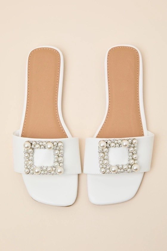 White pearl slide sandals — elegant, comfortable, and perfect for bridal looks, vacations, and summer outfits. Under $30.

Keywords:

* pearl sandals
* white slide sandals
* bridal sandals
* elegant sandals
* flat slide sandals
* summer sandals
* embellished sandals
* dressy sandals
* bridal outfit
* wedding guest outfit
* honeymoon outfit
* summer outfit ideas
* vacation outfit
* resort wear
* beach wedding outfit
* elegant summer look
* quiet luxury style
* soft feminine aesthetic
* coastal chic
* bridal aesthetic
* minimalist elegance
* refined summer style
* european summer look
* effortless luxury

#LTKgrwm #LTKMothersDay #LTKWedding