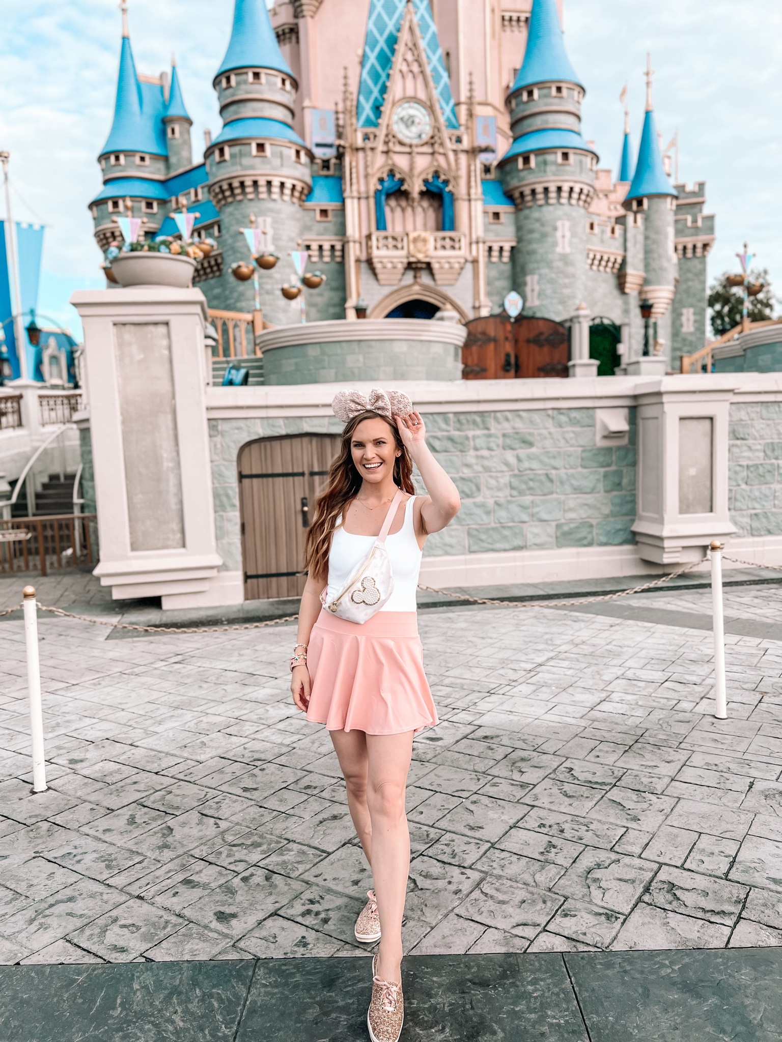 Simple, cute & trendy princess inspired Magic Kingdom outfit🩷 This versatile white bodysuit, pink tennis skirt (with built in shorts and pockets!), pastel Fanny pack and Minnie ears are the perfect combination for a park outfit. A blend of comfort and Disney bounding✨

#LTKtravel #LTKfindsunder50 #LTKSeasonal