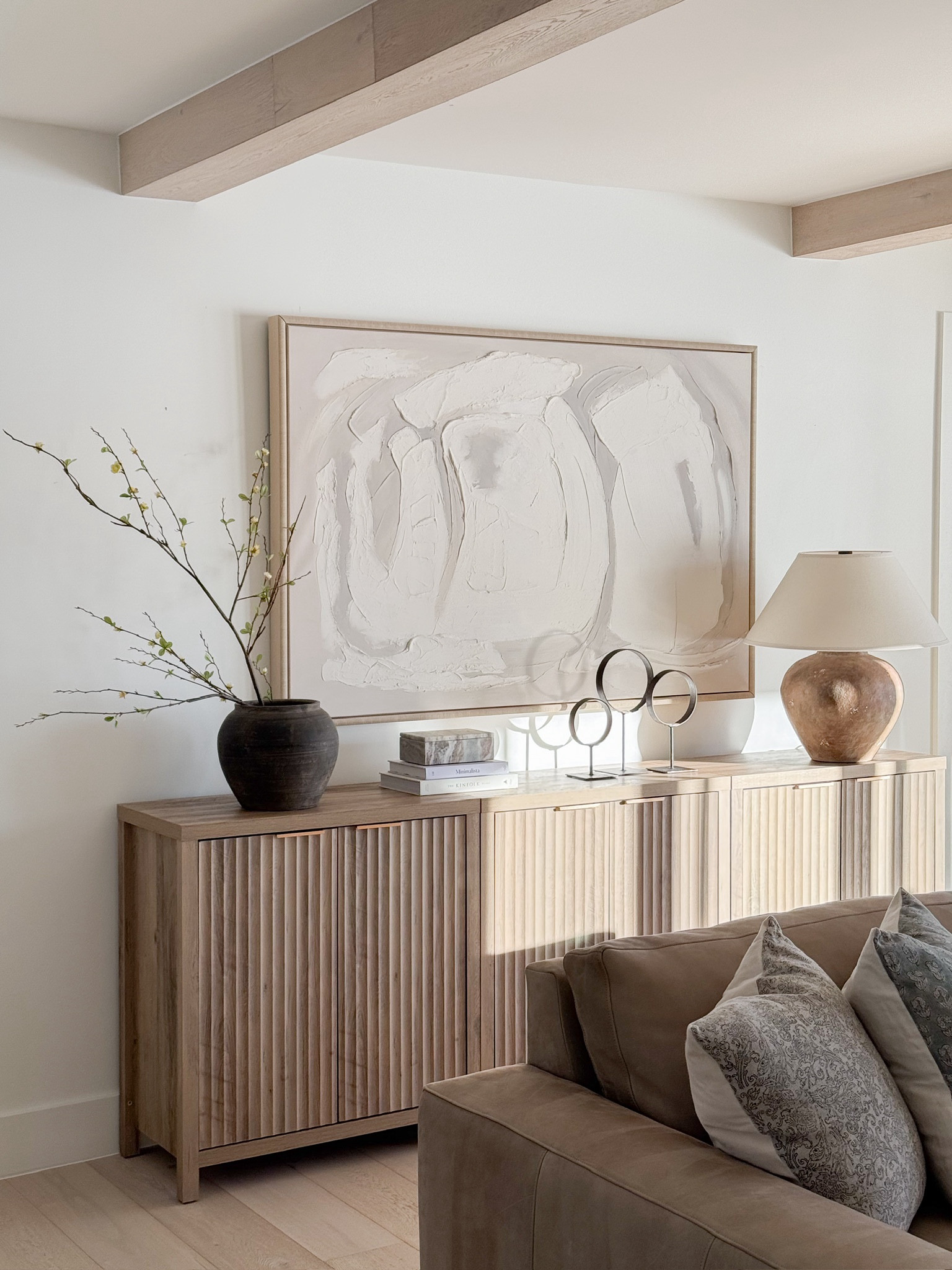 Create a warm and inviting living room with layered textures and neutral tones. From the ribbed console to the elegant decor accents, this space is the perfect blend of style and comfort. Shop here!

#LTKFindsUnder100 #LTKHome #LTKStyleTip