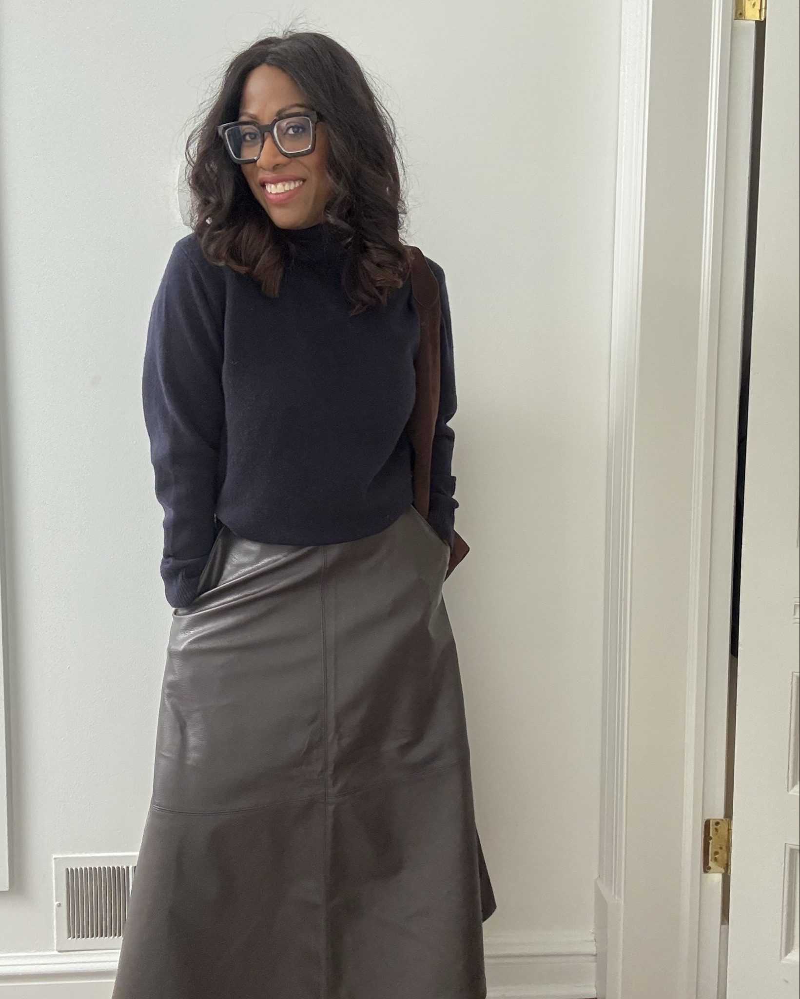 Wearing one of my favorite turtleneck on repeat with this (faux) leather skirt from H & M.  Tall boots make for an elegant outfit for work or dinner with friends.

#LTKStyleTip #LTKOver40 #LTKShoeCrush