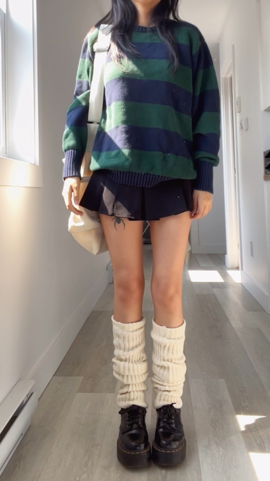 i got the sweater from brandy melville “brianna sweater” and the leg warmers from brandy also. 
The skirt is from The kript but it was a while ago!