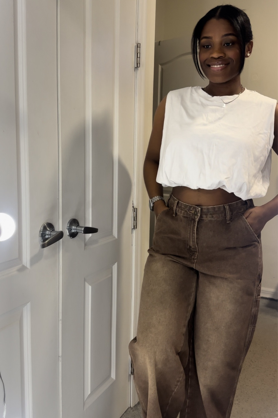 The perfect baggy jeans in this brown color! If you’re interested in the tank too, I have it linked as well. Super cute basic. 