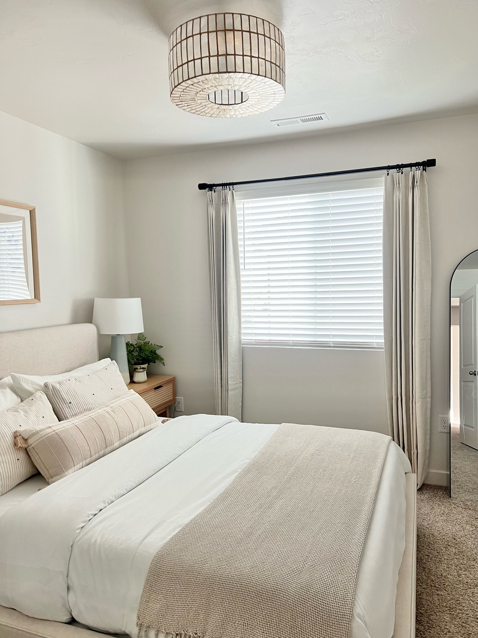 Affordable linen pinch pleat drapes, neutral bedroom, bedroom curtains, blackout curtains. 

#LTKunder100 #LTKhome #LTKfamily