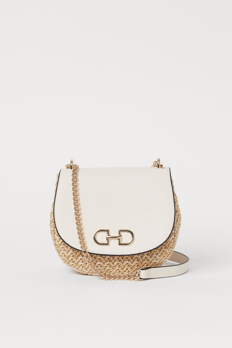 Sturdy shoulder bag with a metal decoration on the flap, concealed magnetic fastener under the fl... | H&M (UK, MY, IN, SG, PH, TW, HK)